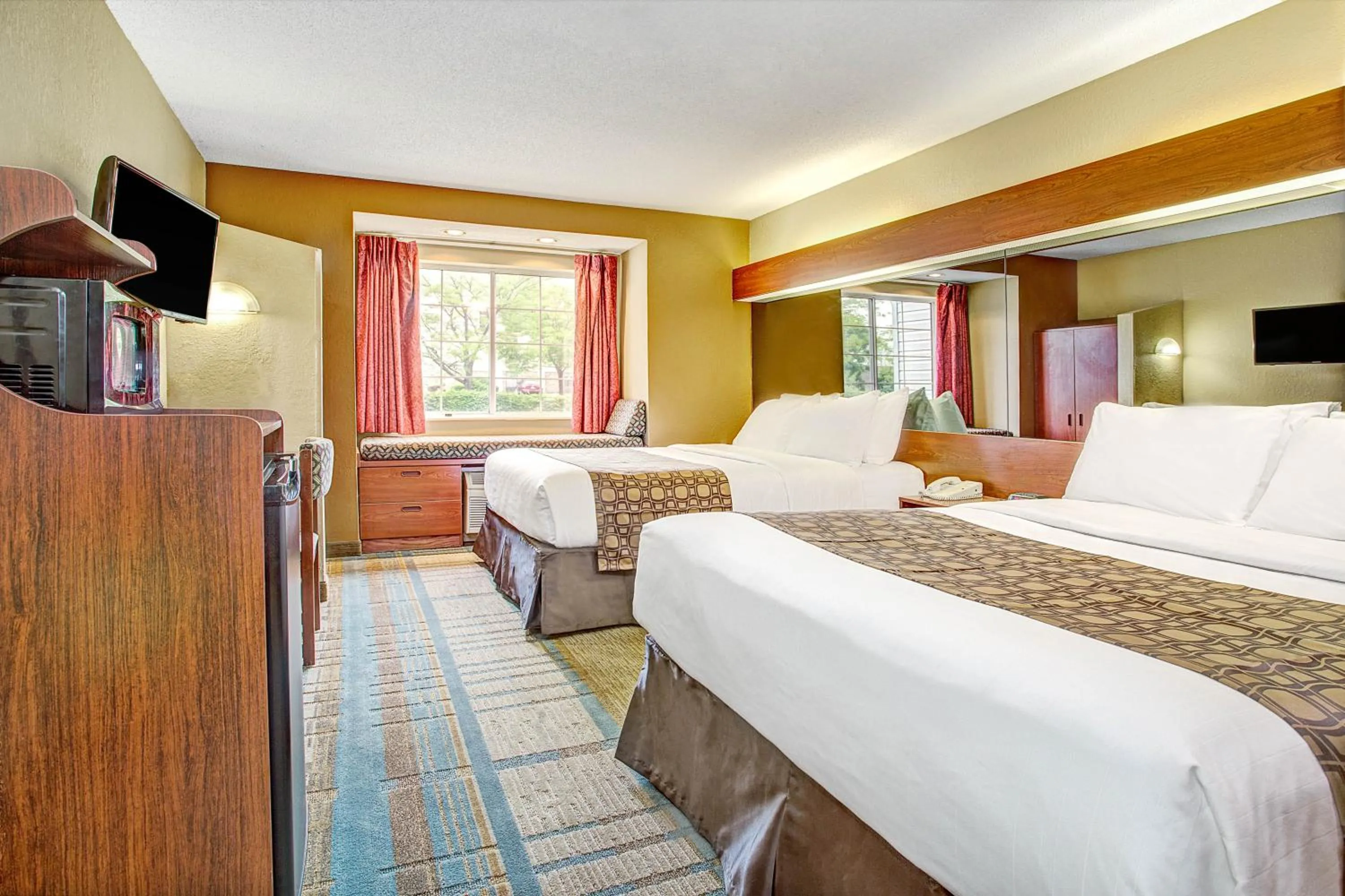 Bed in Microtel Inn & Suites by Wyndham Mason