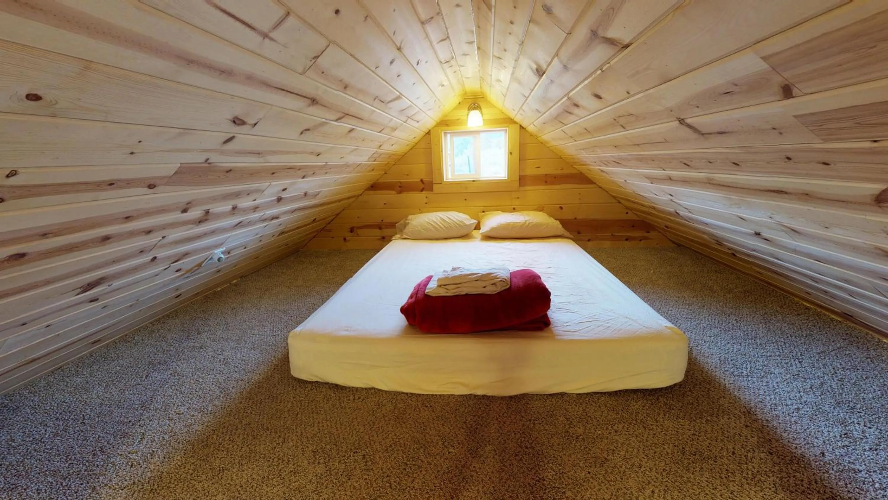 Bed in White Pine Cabin by Canyonlands Lodging