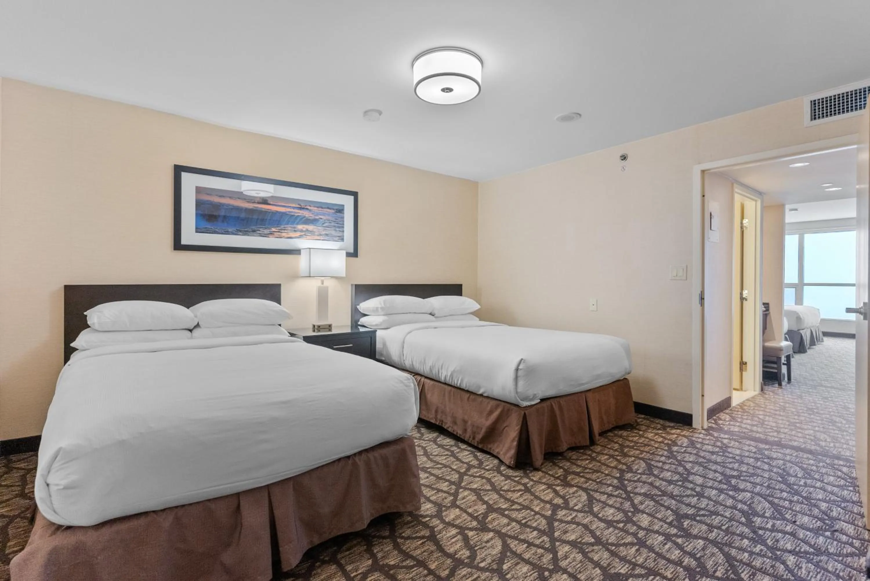 Bed in Embassy Suites by Hilton Niagara Falls/ Fallsview