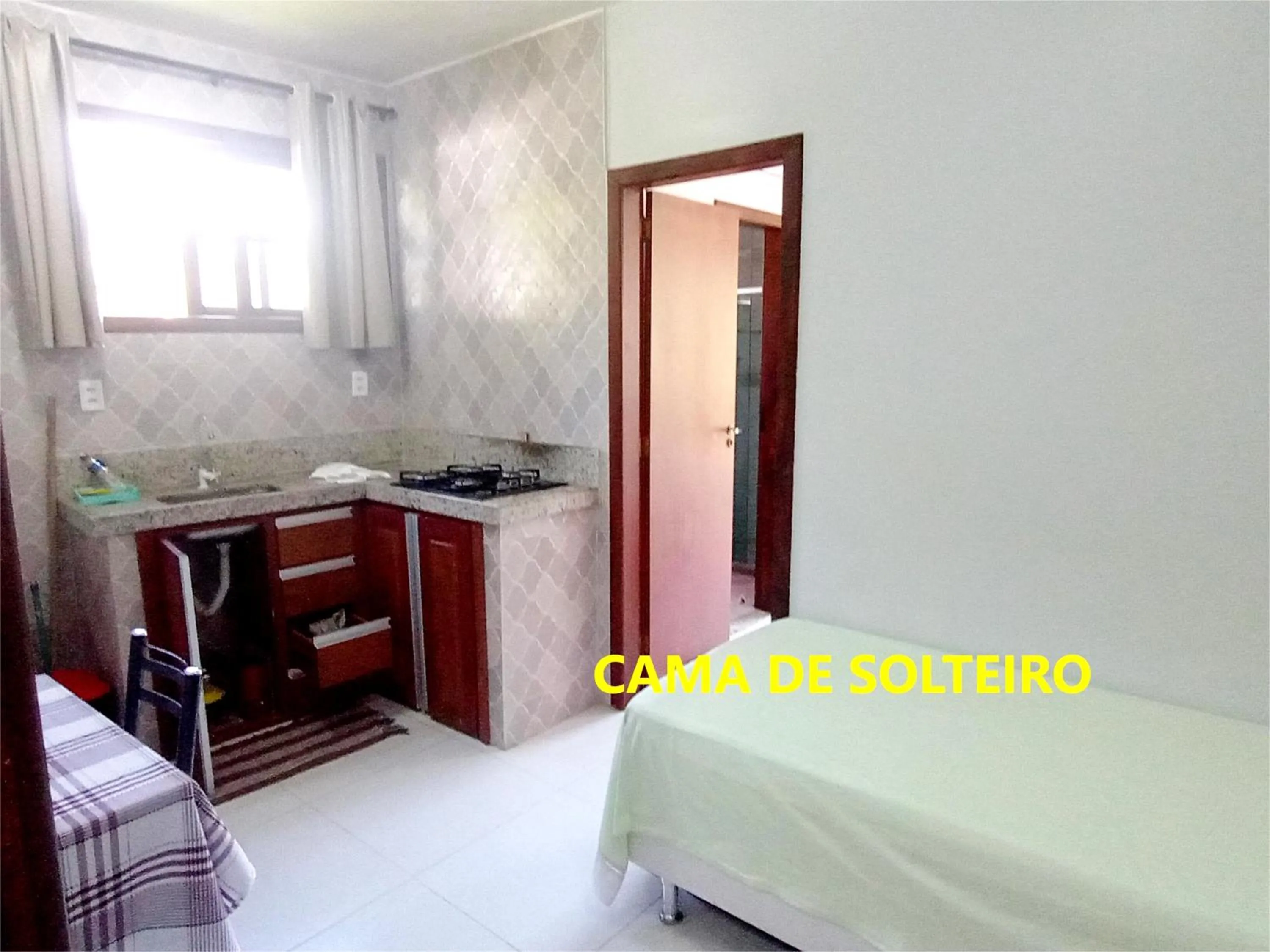 Kitchen or kitchenette, Bed in Pousada Lagoa Flat