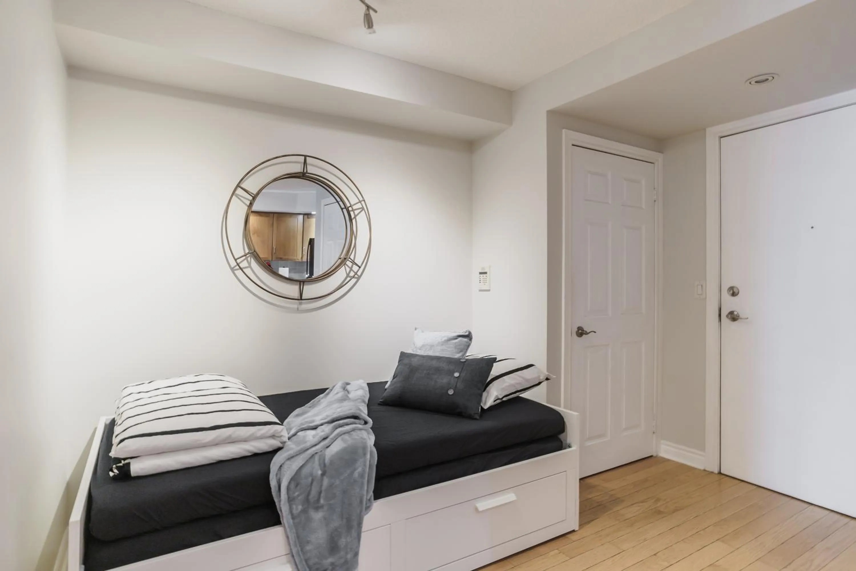 Seating area, Bed in AOC Suites - Heart of Downtown Condo