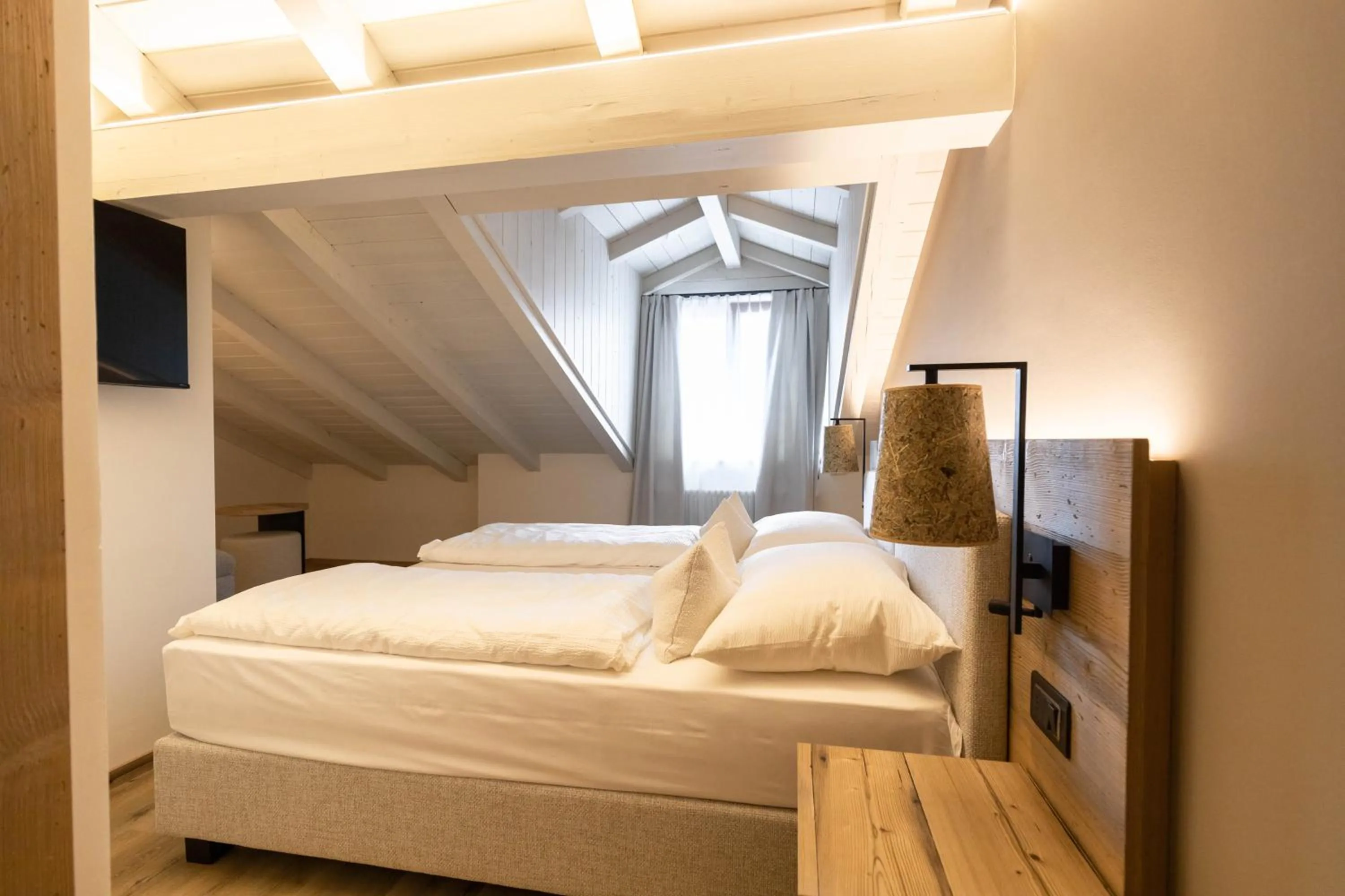 Bed in Hotel Alpenrose Wellness