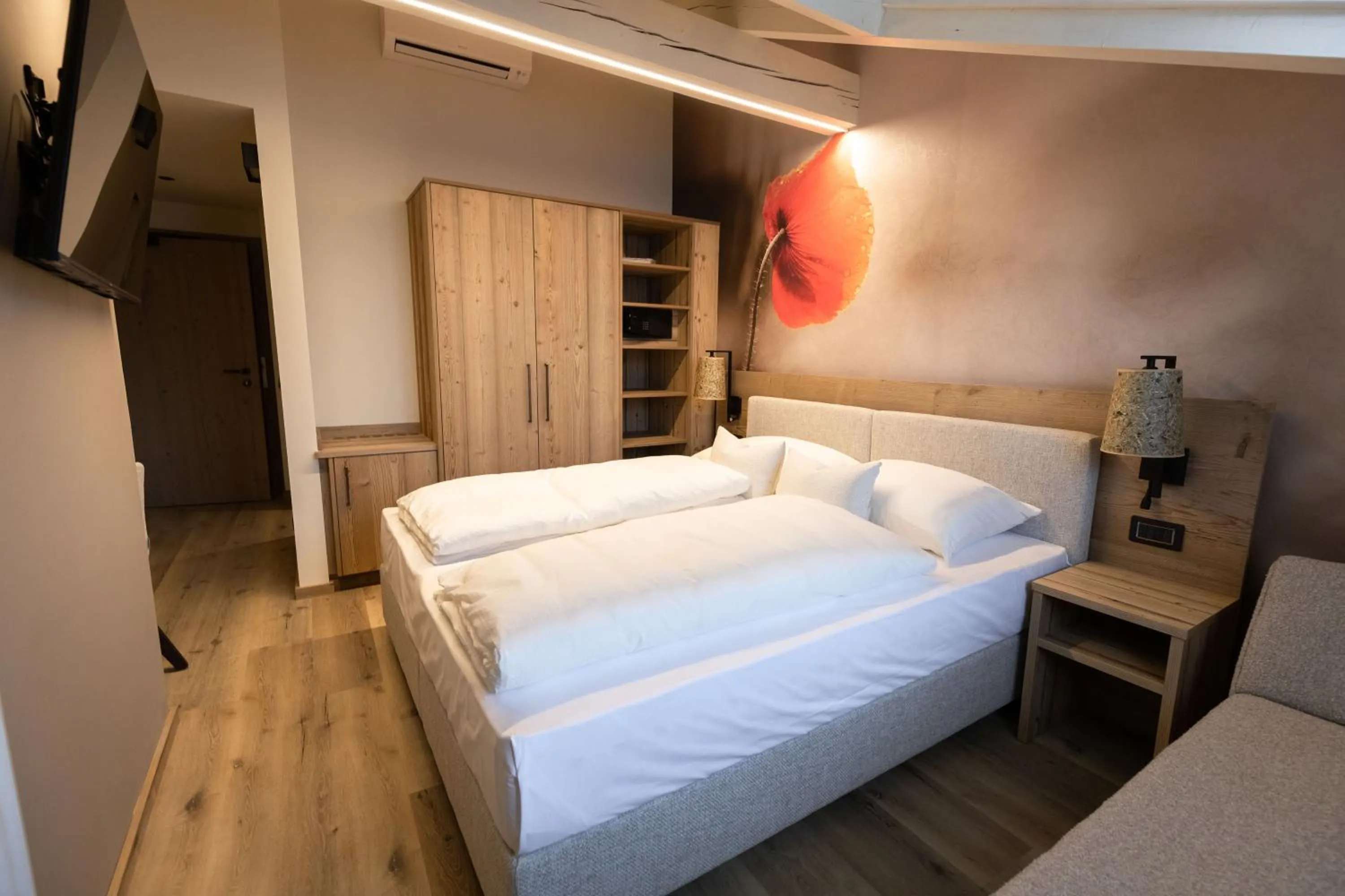 Bed in Hotel Alpenrose Wellness