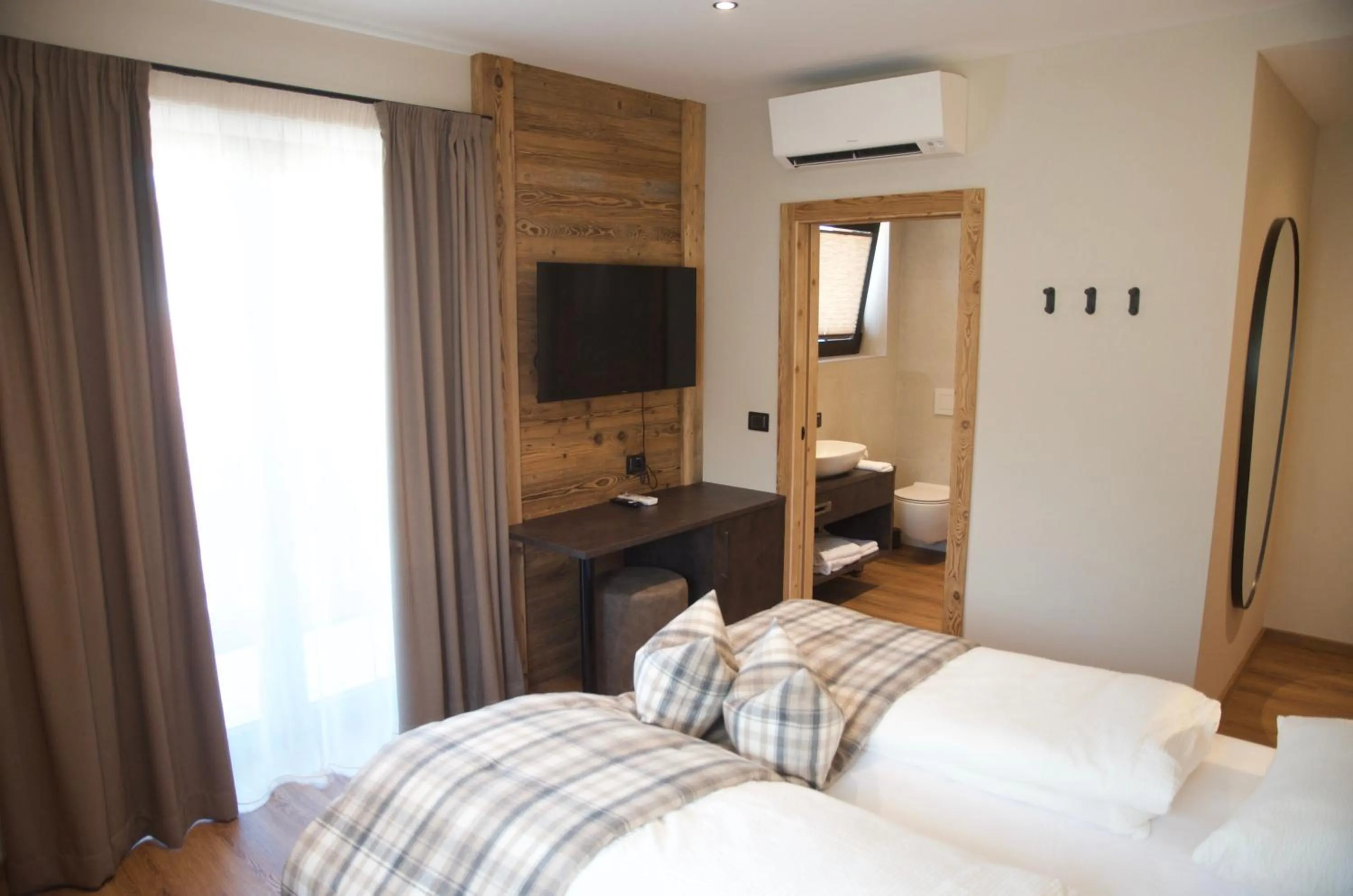 Bed in Hotel Alpenrose Wellness