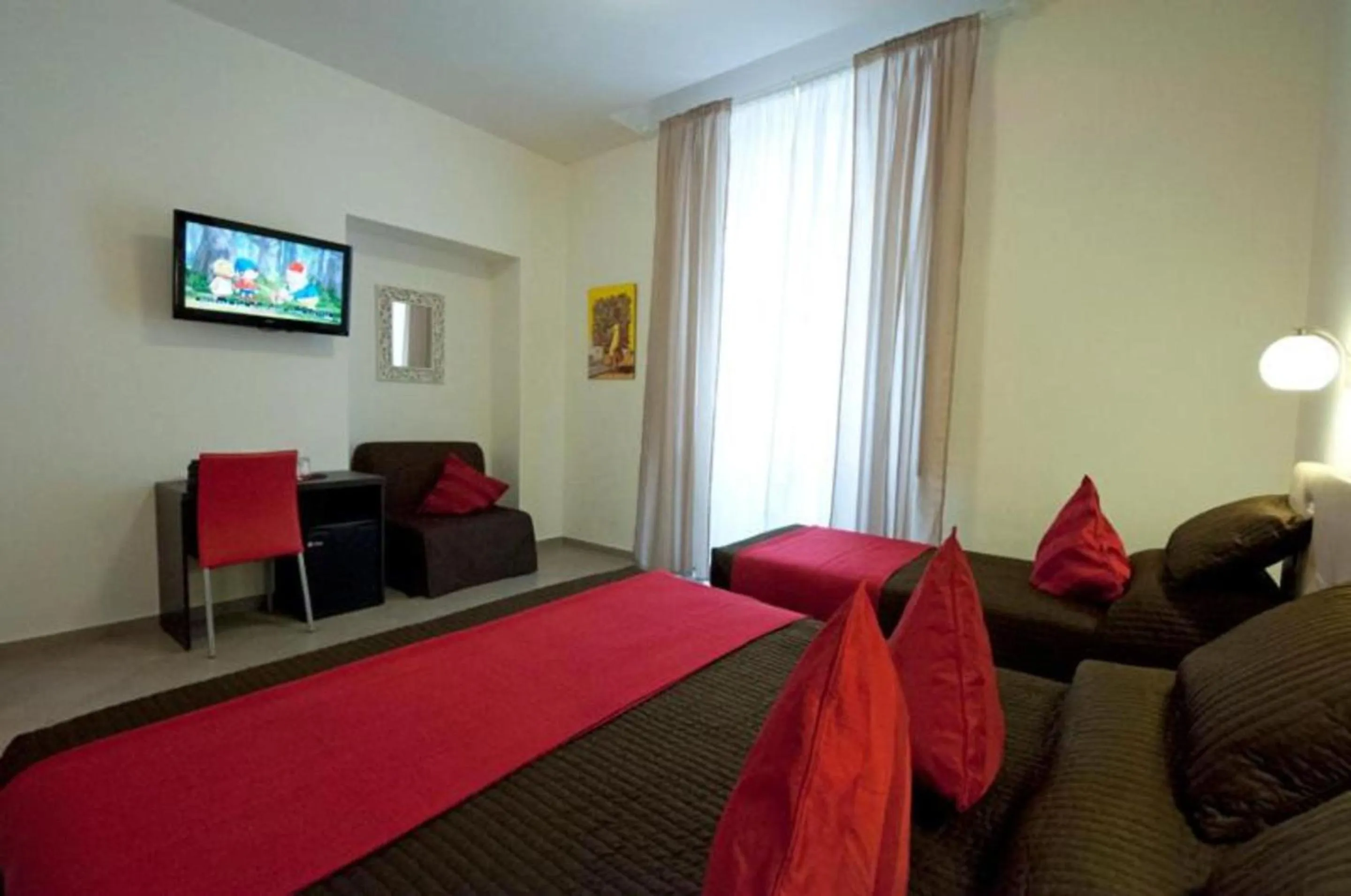 Bed in Ara Pacis Inn