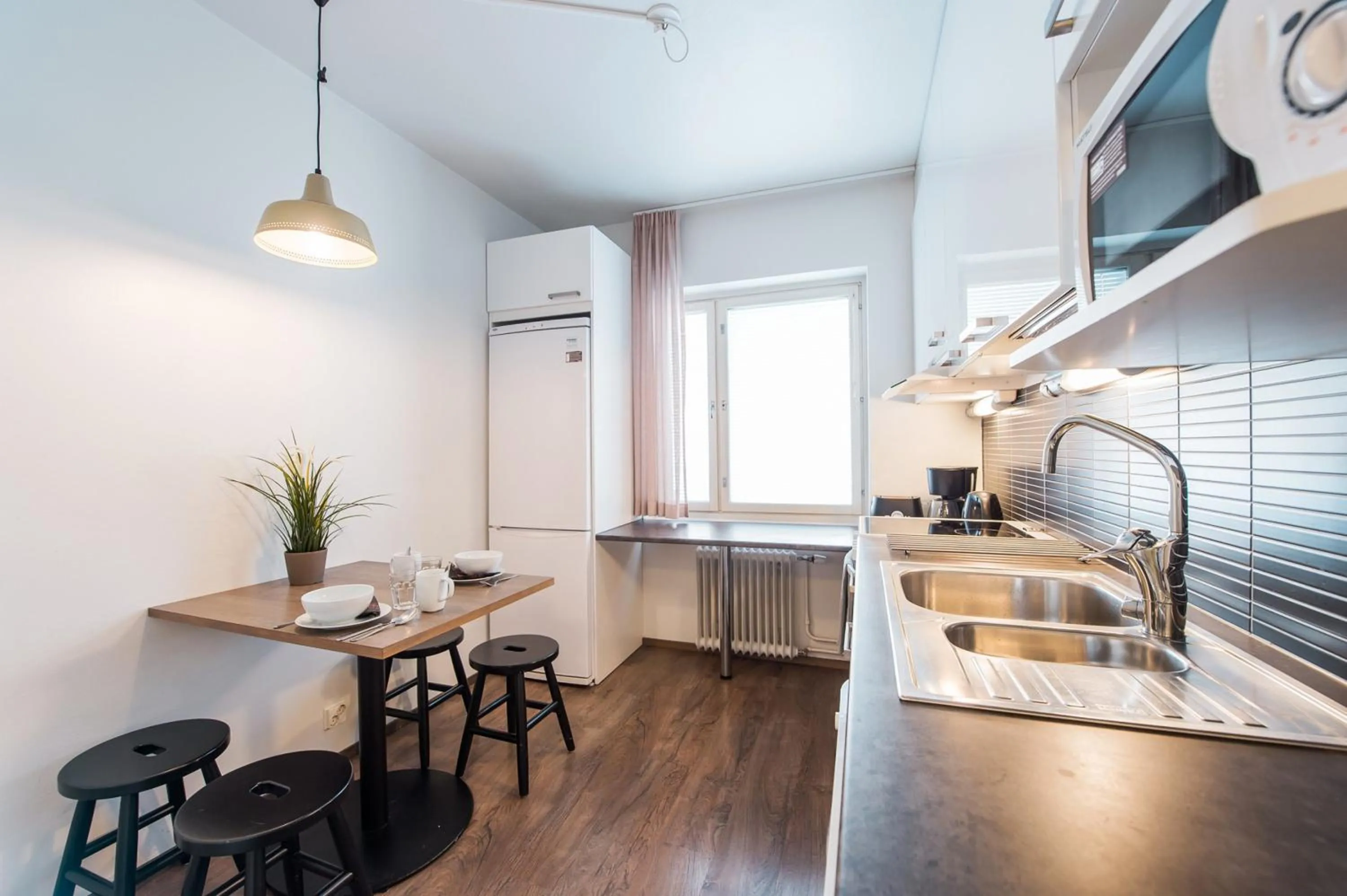 Kitchen or kitchenette in Forenom Serviced Apartments Helsinki Lapinlahdenkatu