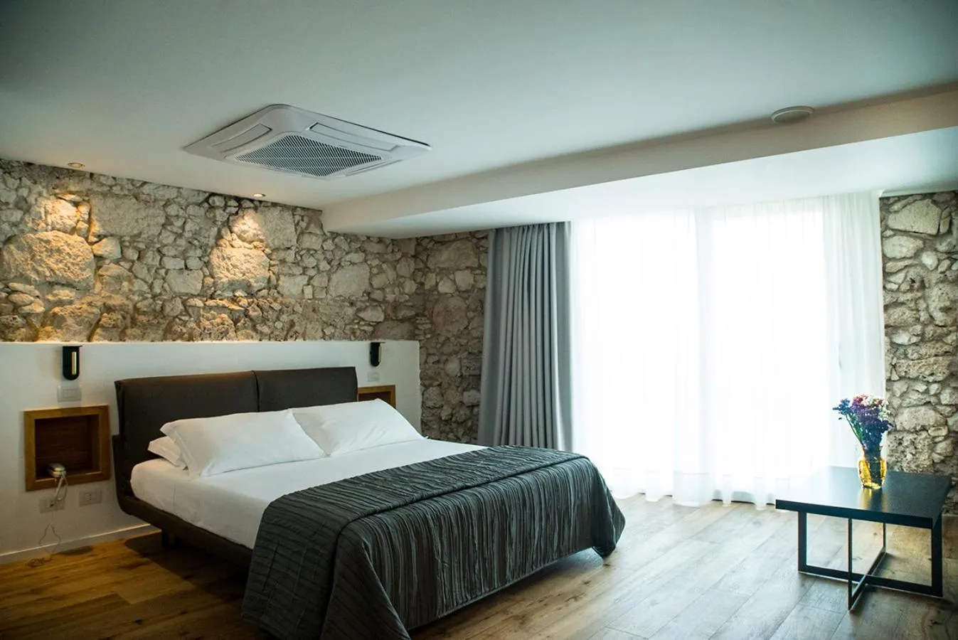 Bed in Re Dionisio Luxury Suites