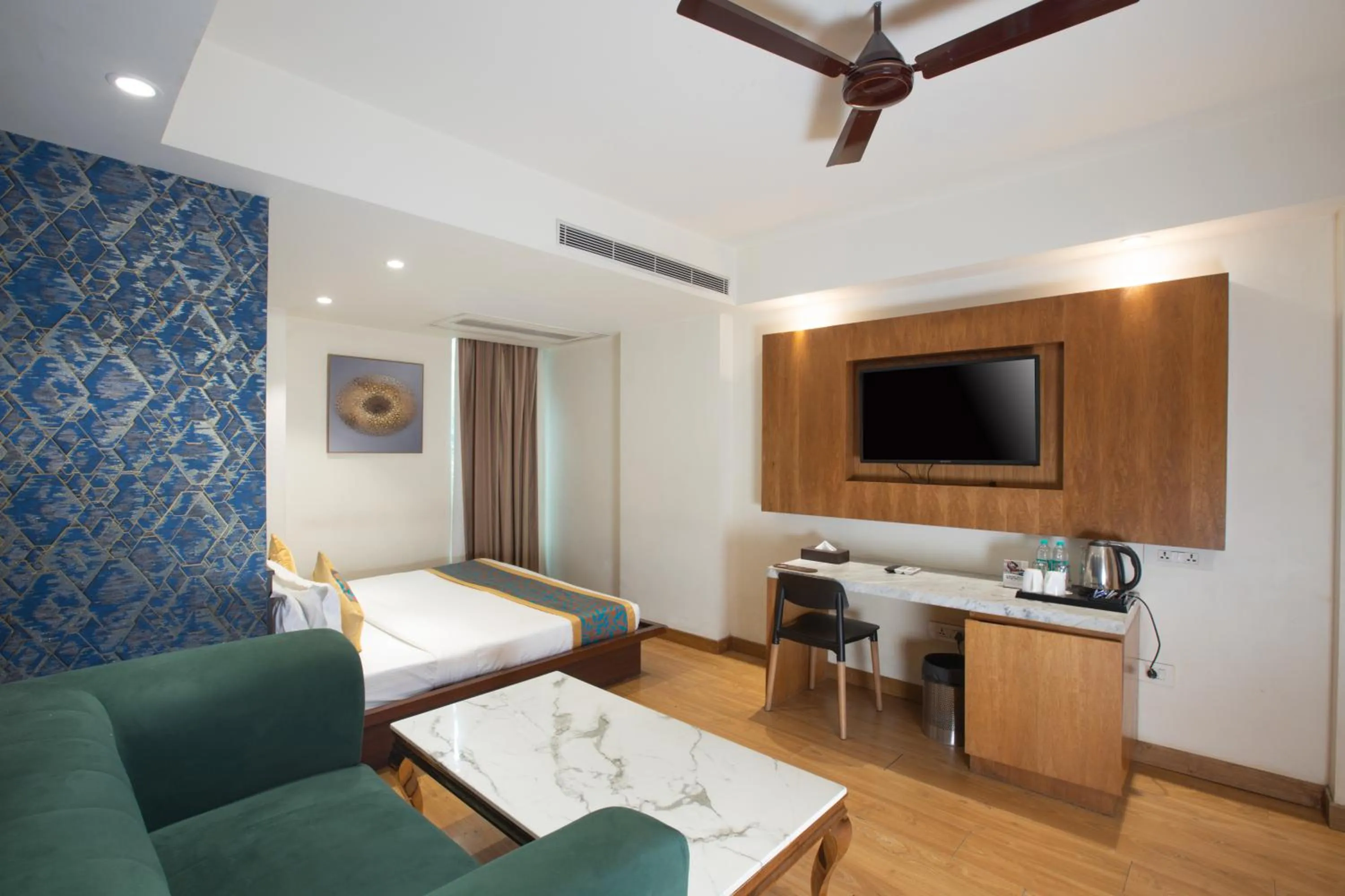 Living room, Bed in The Orion Plaza - Nehru Place