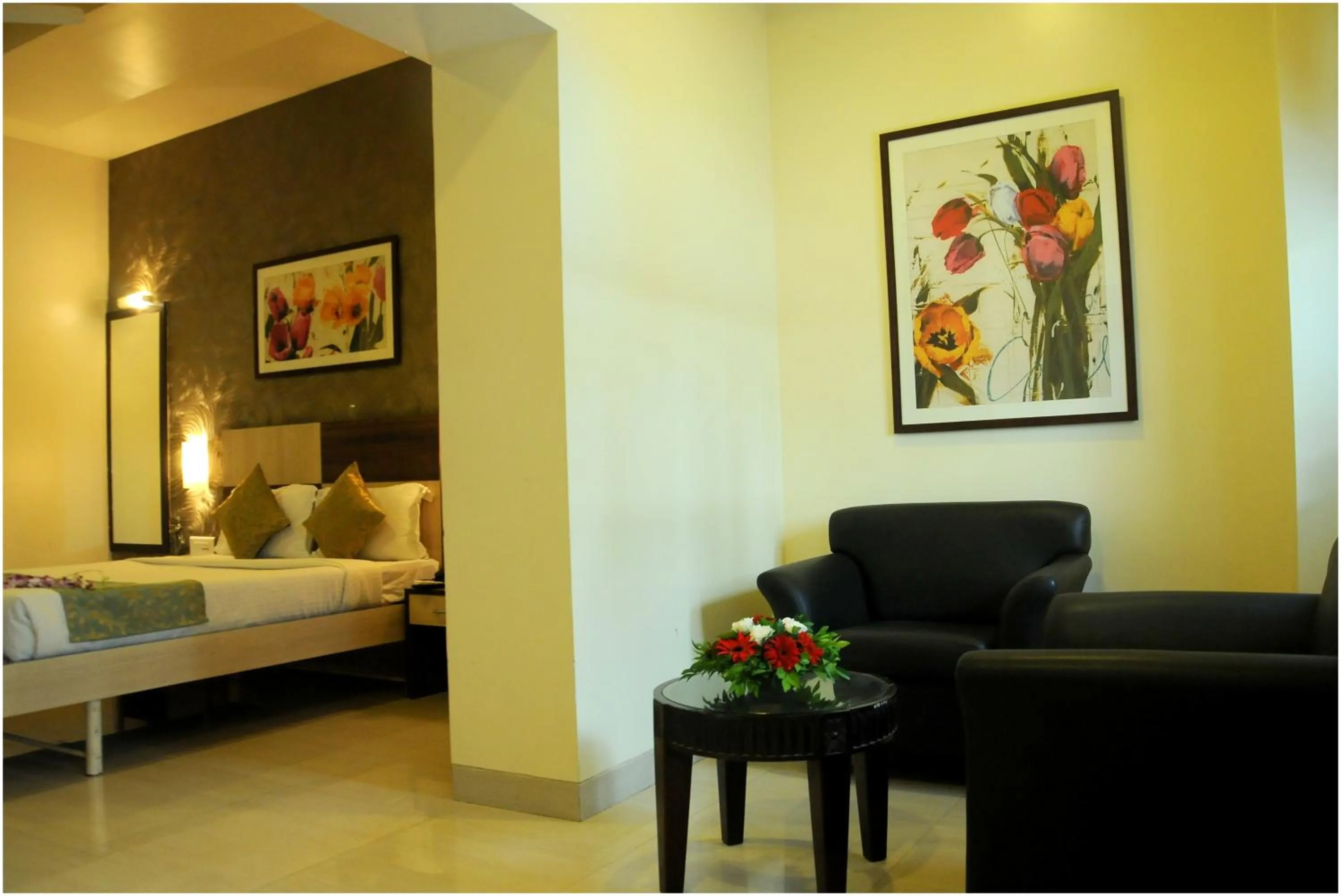 Seating area, Bed in Hotel Madhav International Pune Railway Station