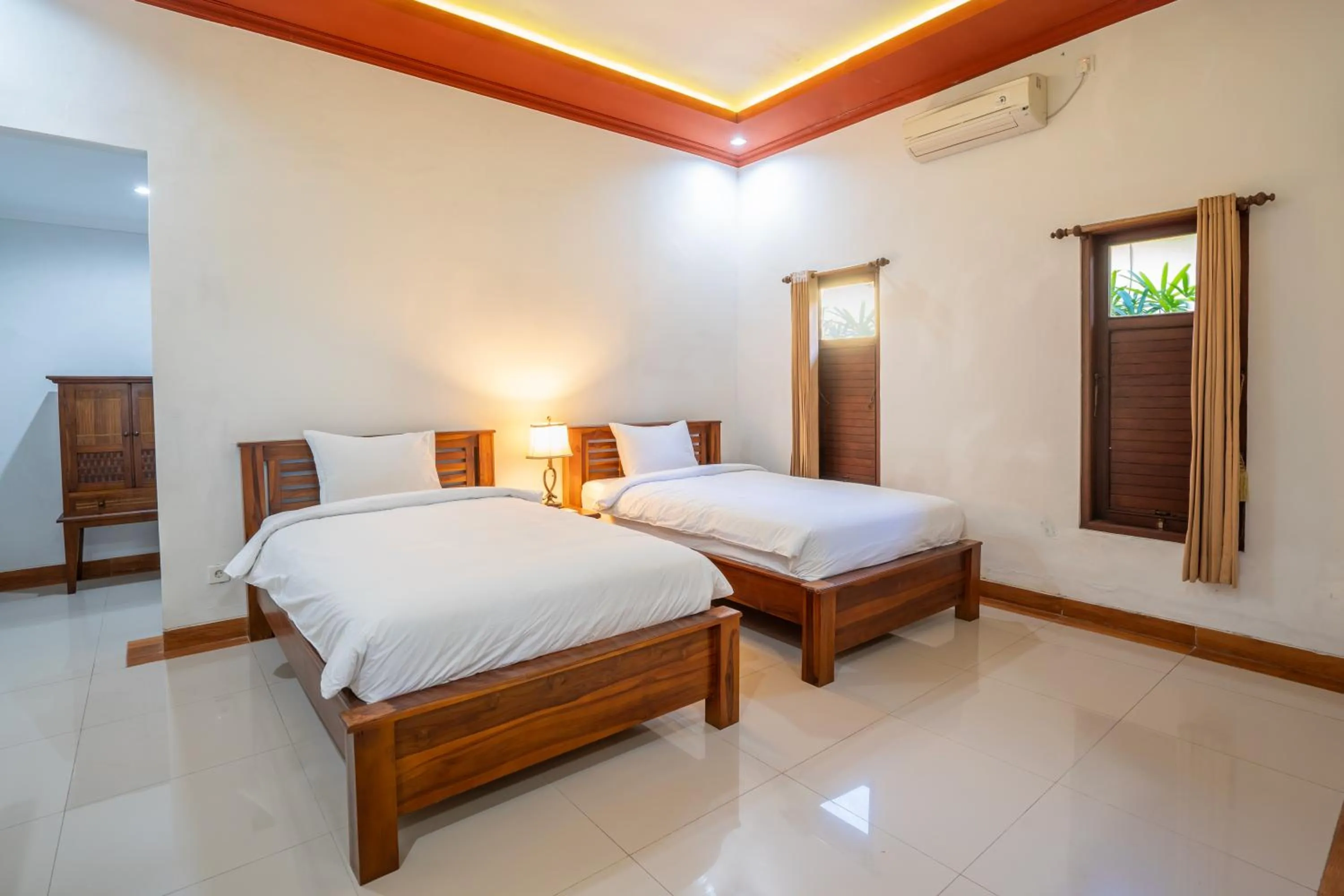 Bed in Nirmala Guest House Surf Keramas