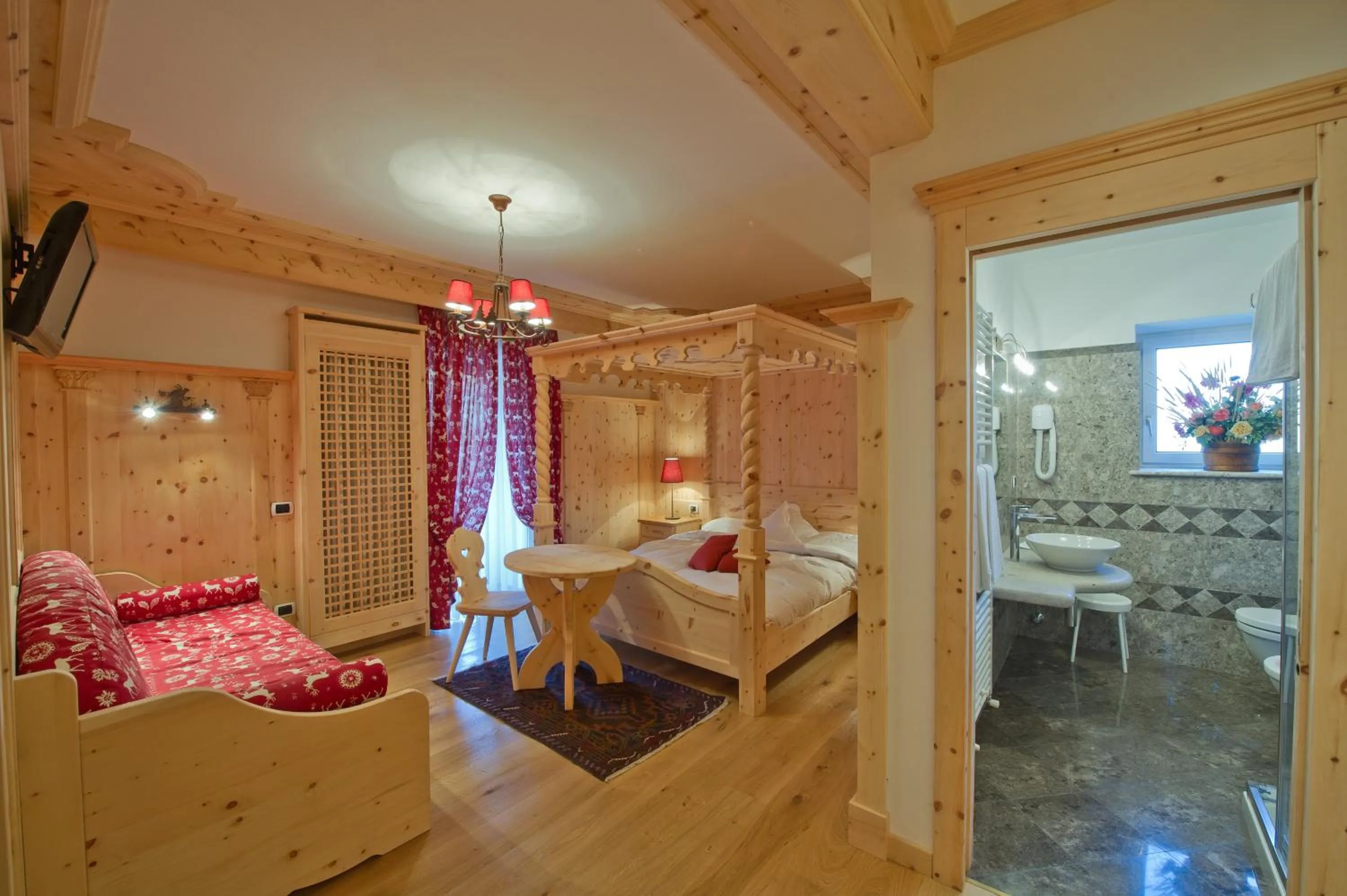 Bed in Belvedere Dolomites Flower Hotel