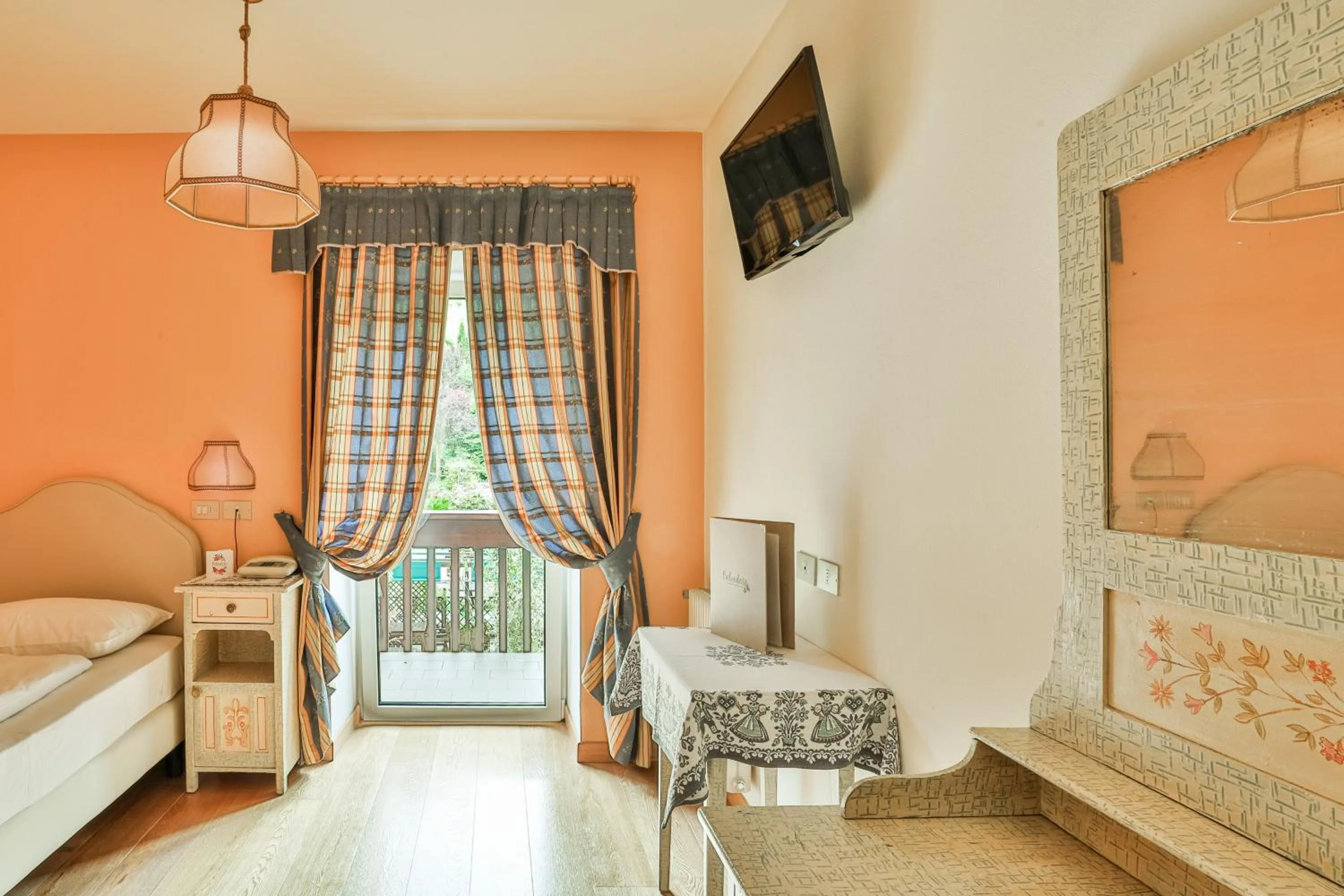 Bed in Belvedere Dolomites Flower Hotel