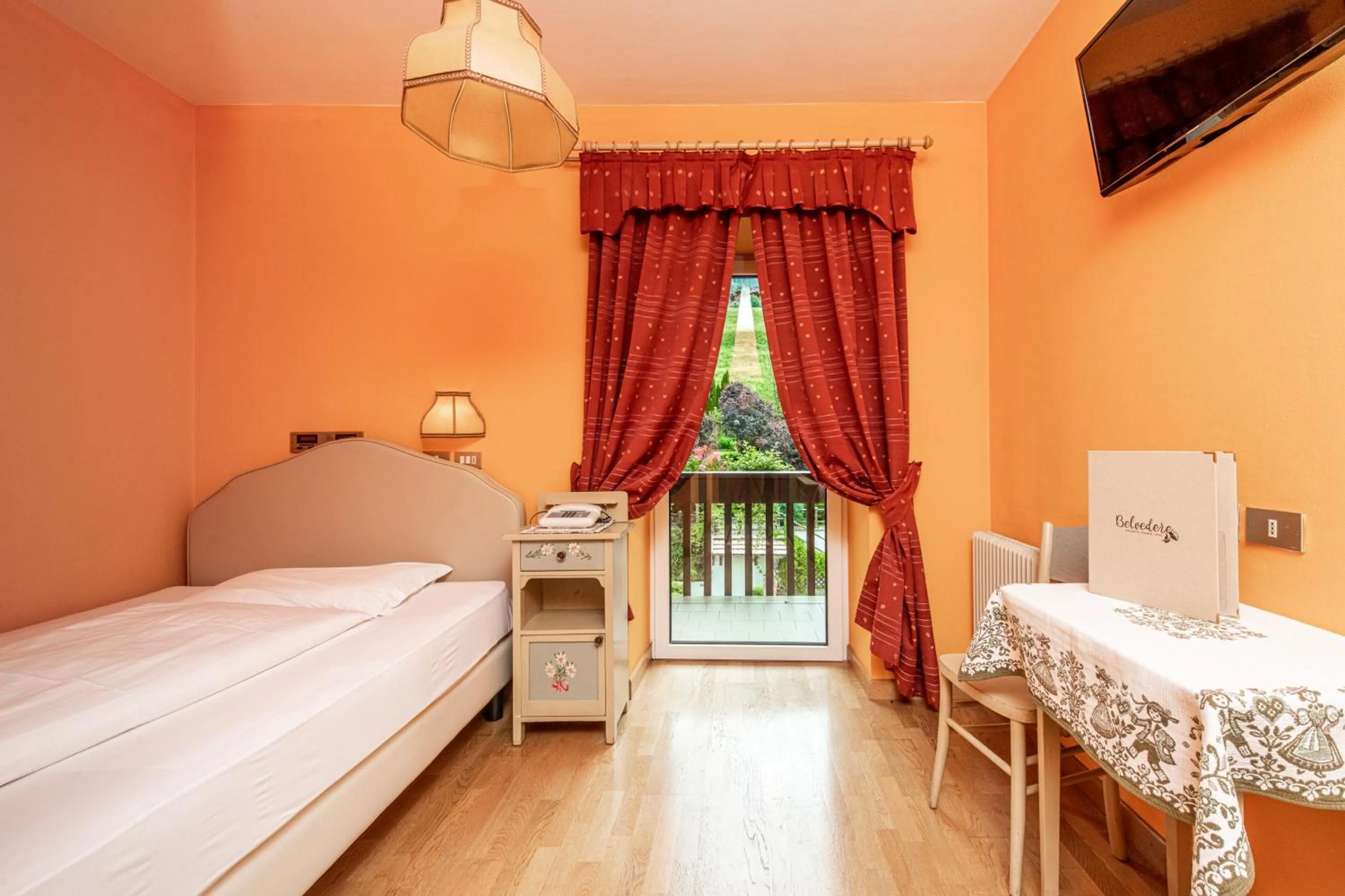 Bed in Belvedere Dolomites Flower Hotel