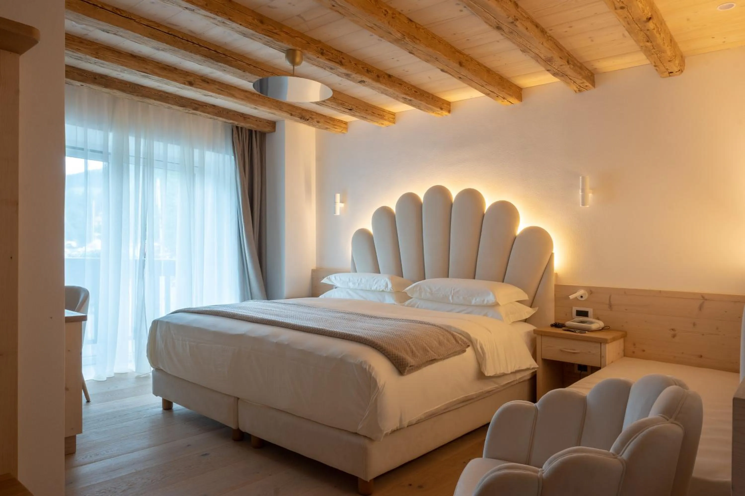 Bed in Belvedere Dolomites Flower Hotel