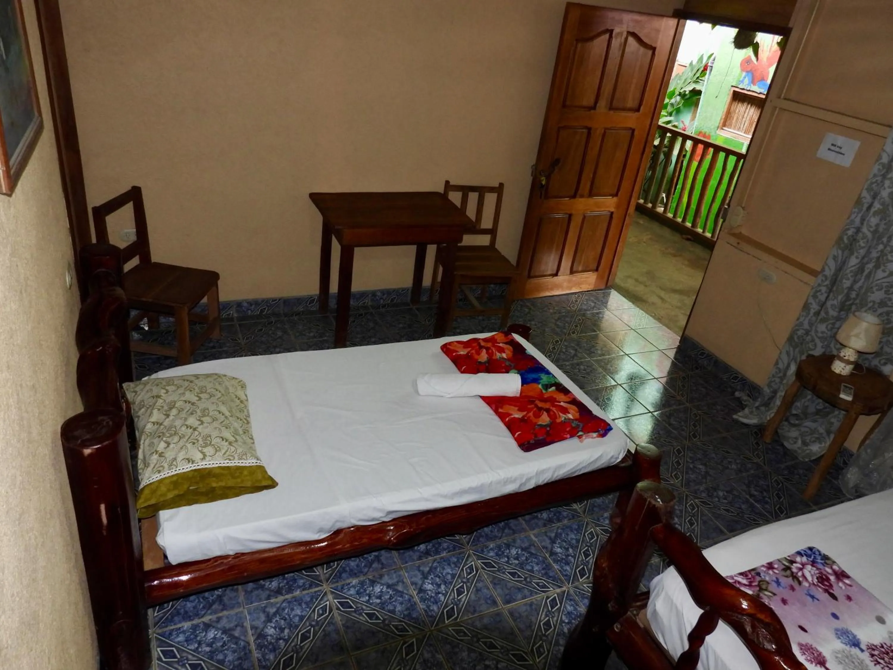 Bed in Iguanitas Lodge