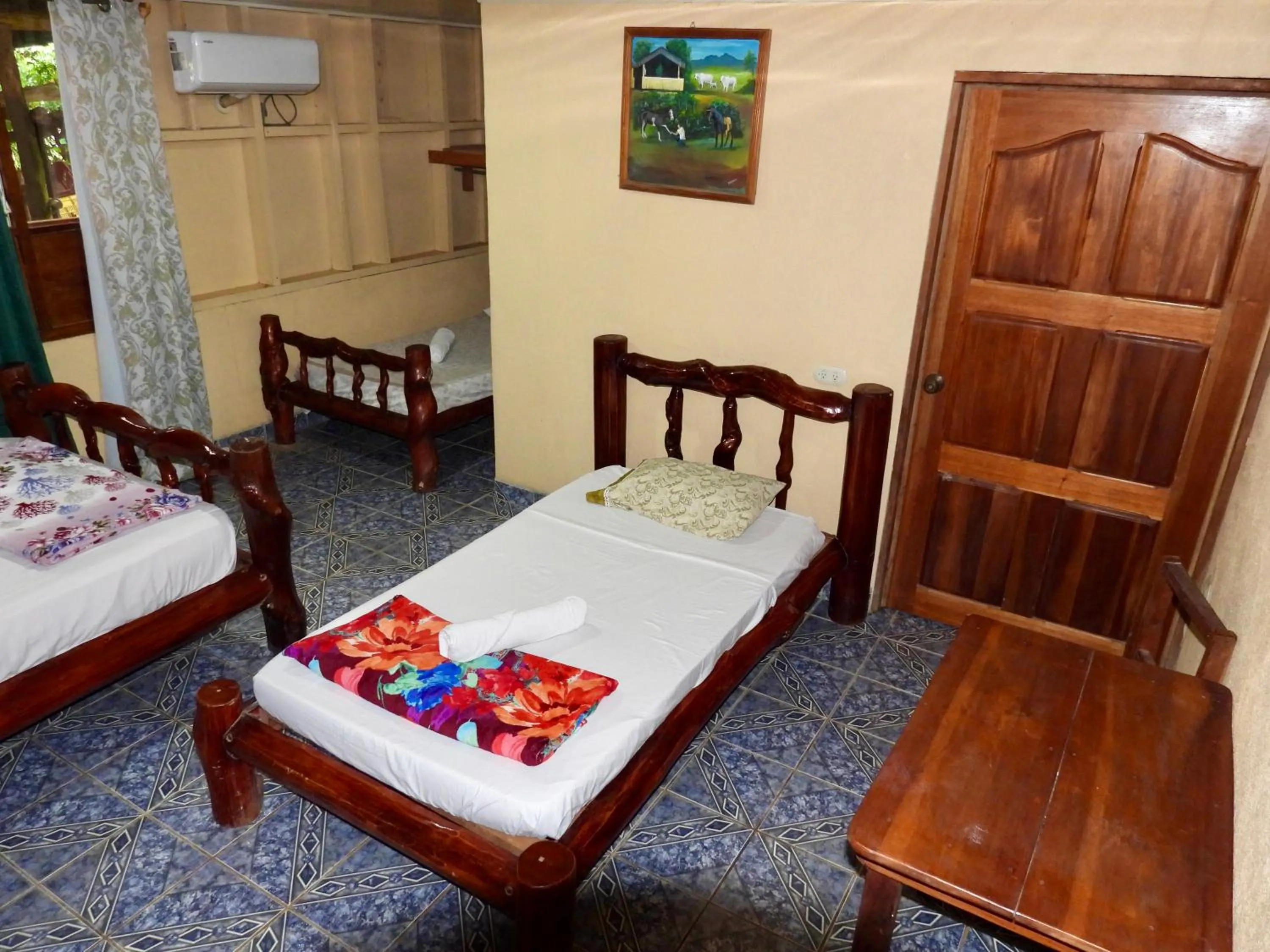 Bed in Iguanitas Lodge
