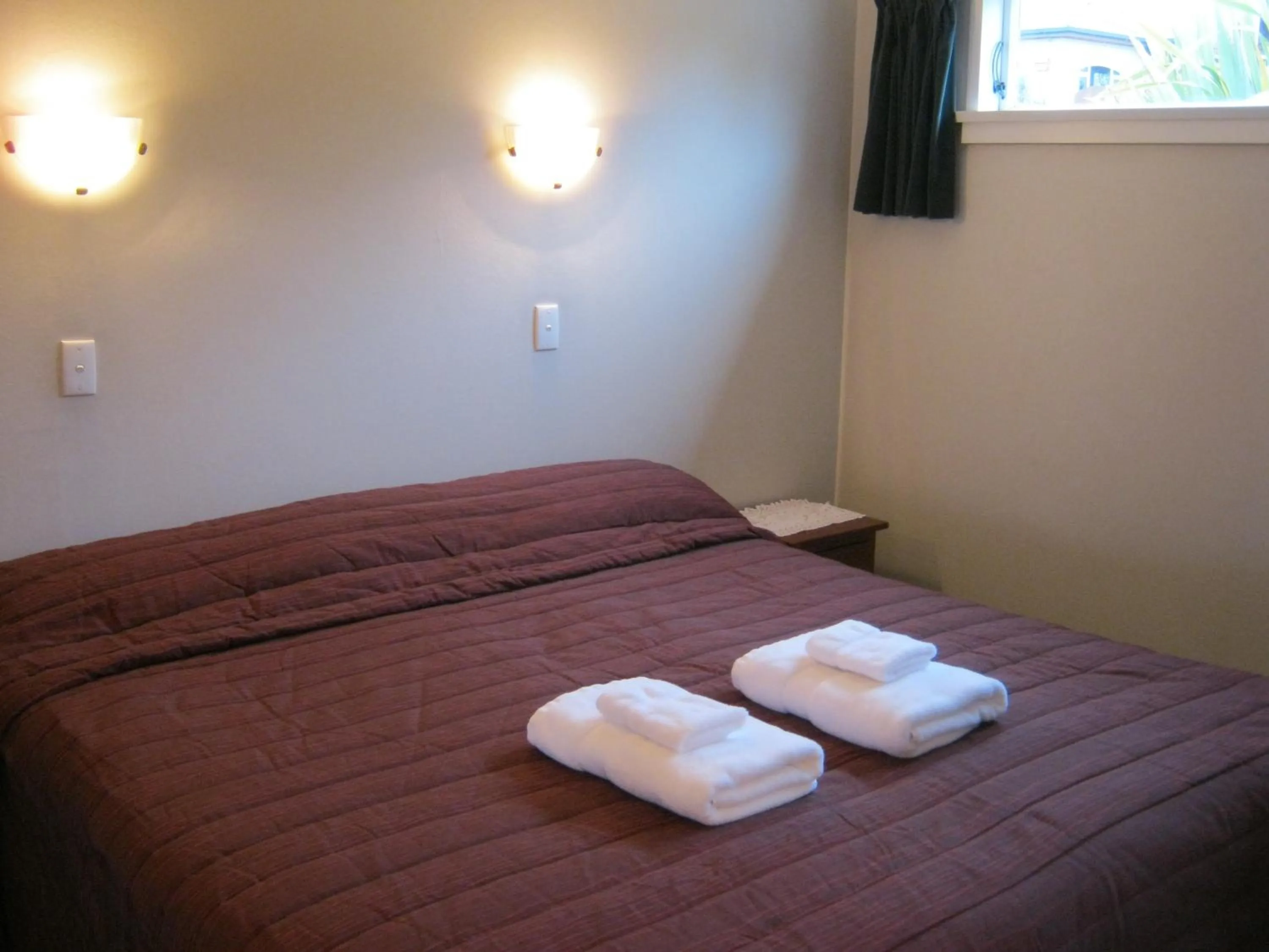 Bed in Blue Dolphin Motel