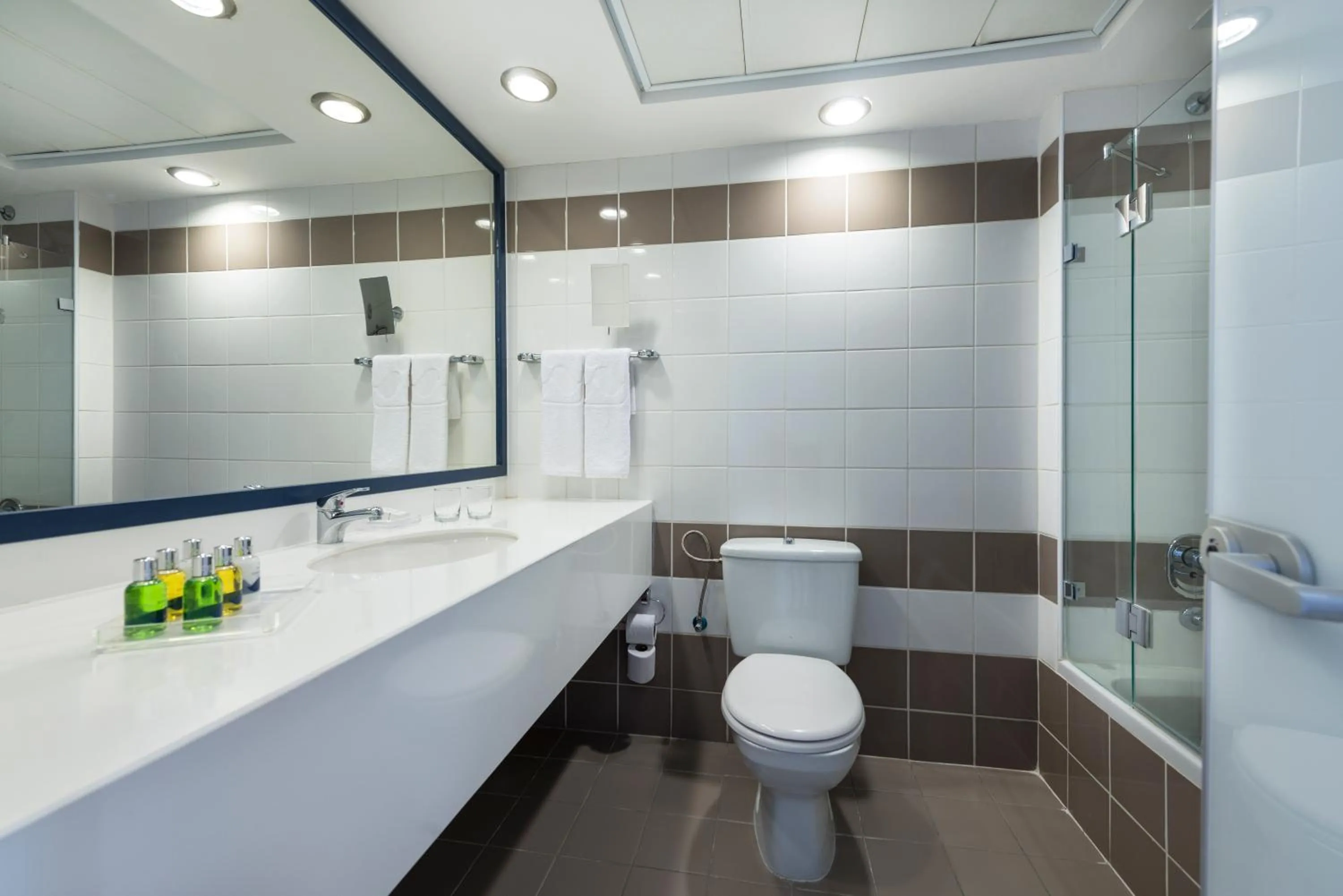 Bathroom in Sport Club by Isrotel Collection