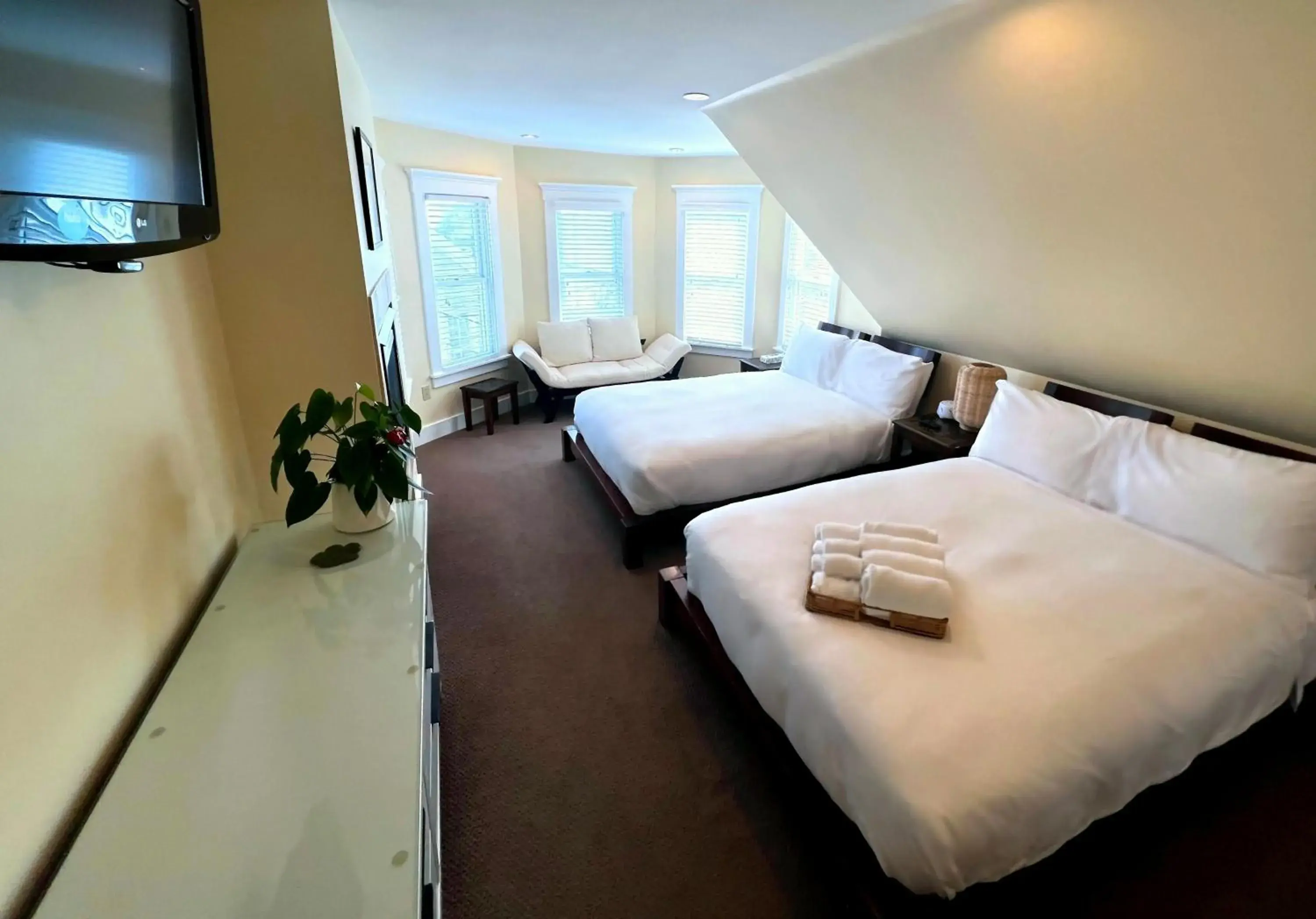 Double Room with Two Double Beds and Fireplace in Lotus Provincetown Double Room with Two Double Beds and Fireplace in Lotus Provincetown