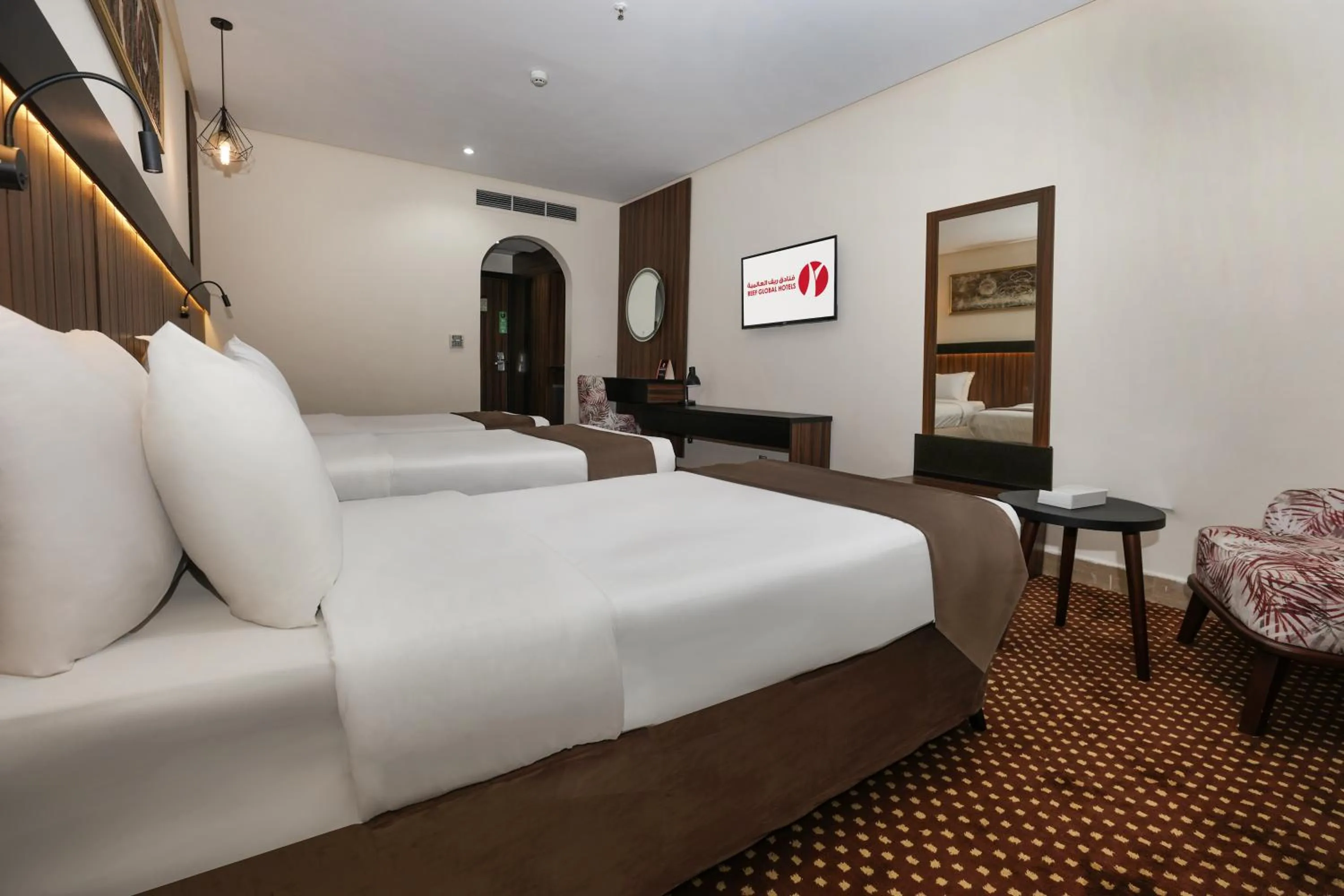Bed in Reef Global Hotel