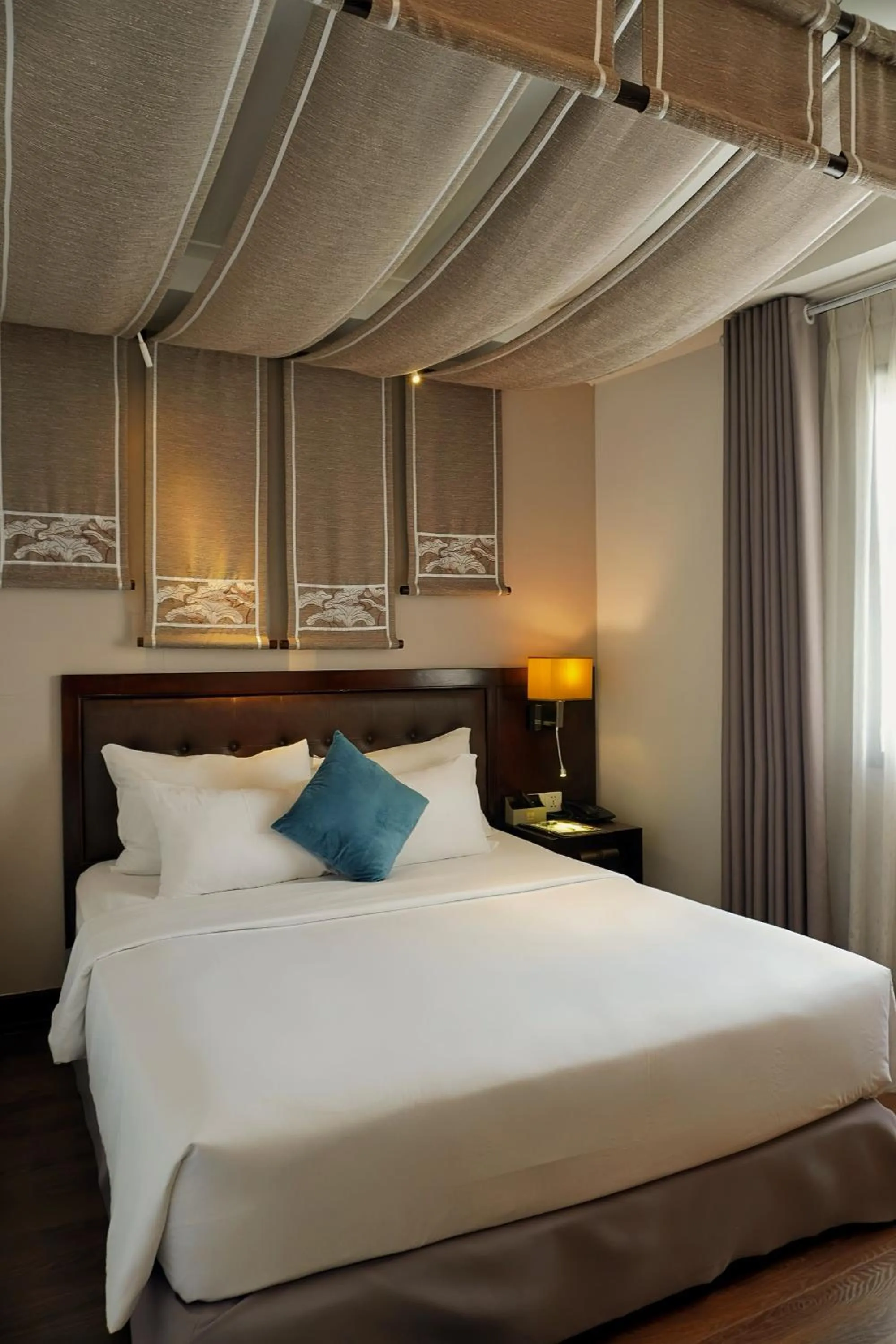 Bed in The Odys Boutique Hotel