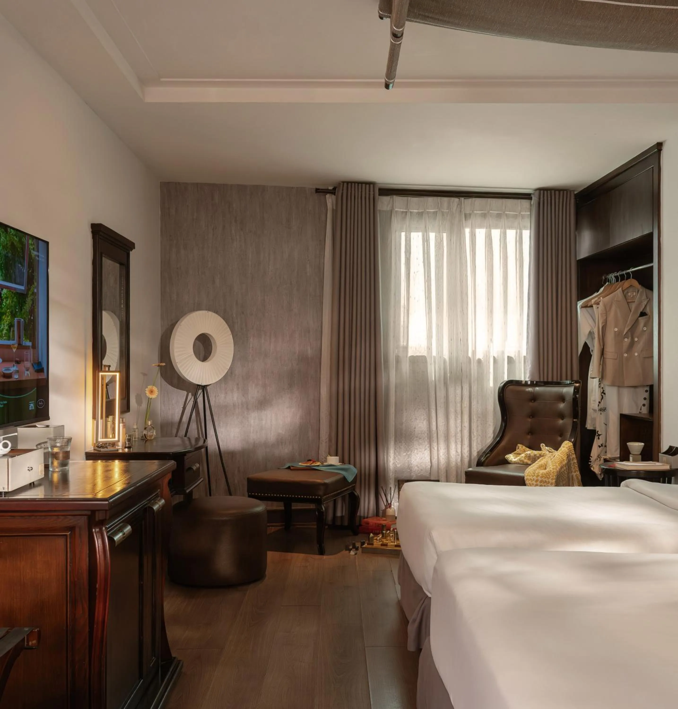 Seating area, Bed in The Odys Boutique Hotel