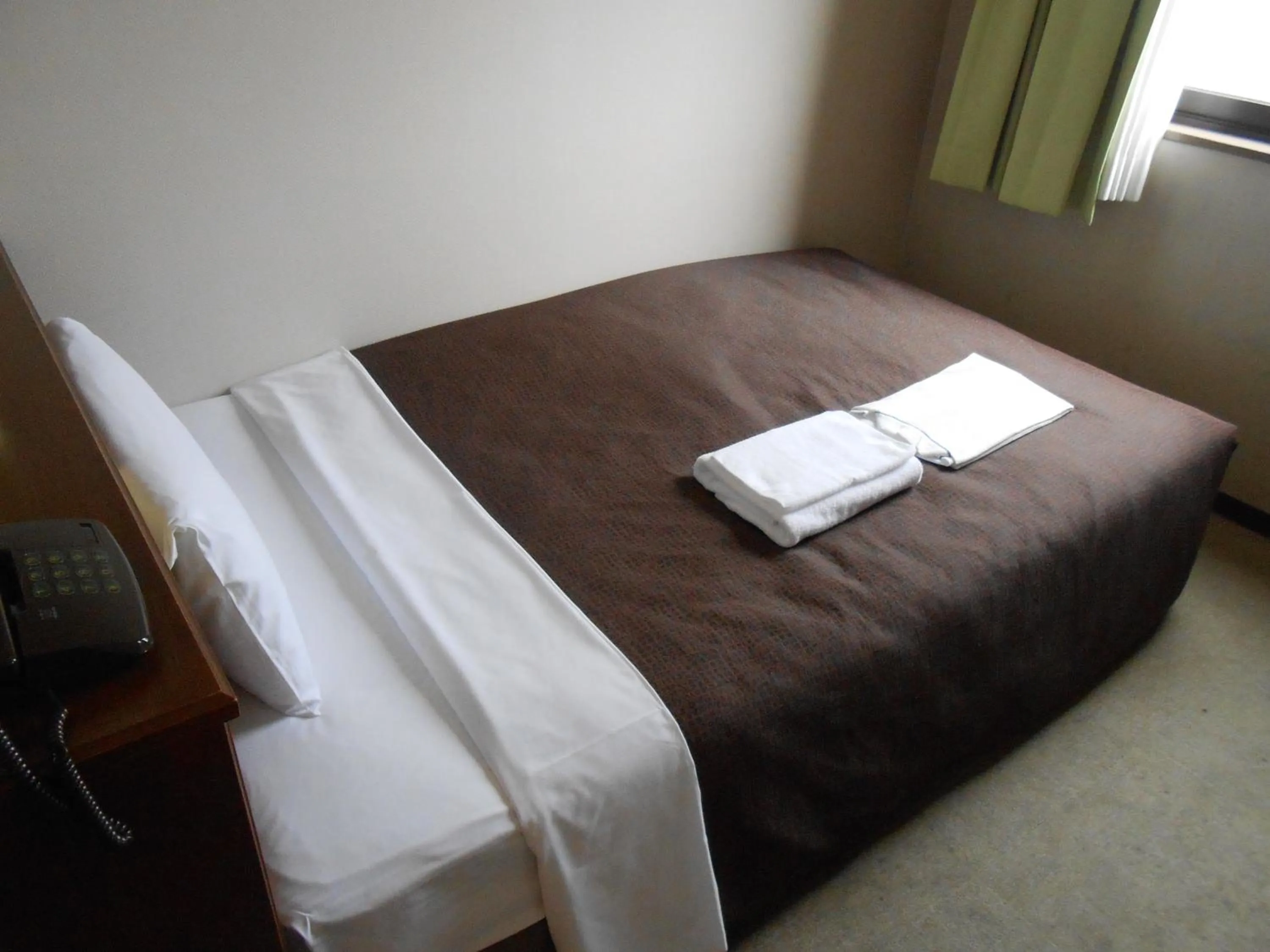 Bed in Select Inn Mishima
