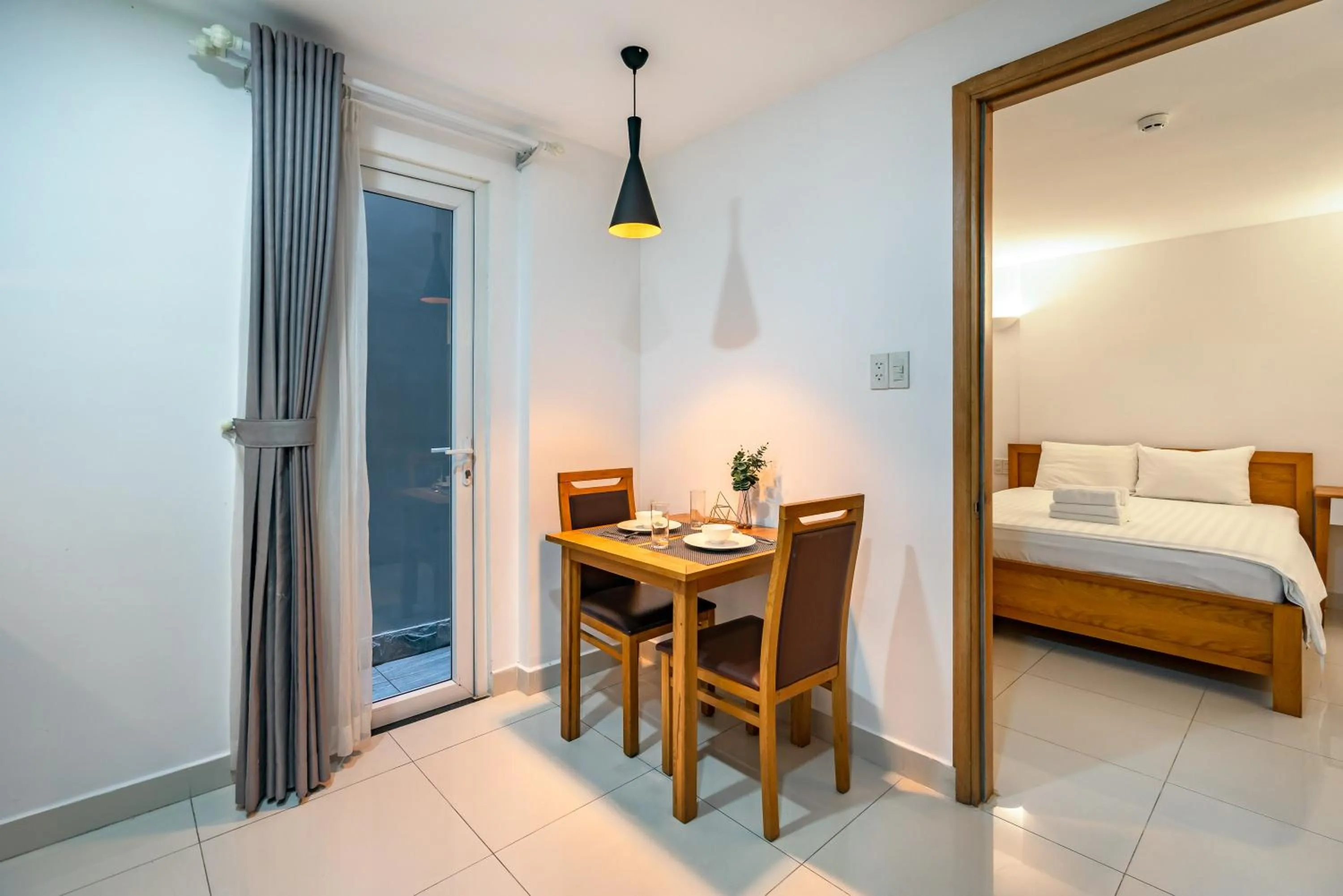 Dining area, Bed in SaigonOne Serviced Apartment