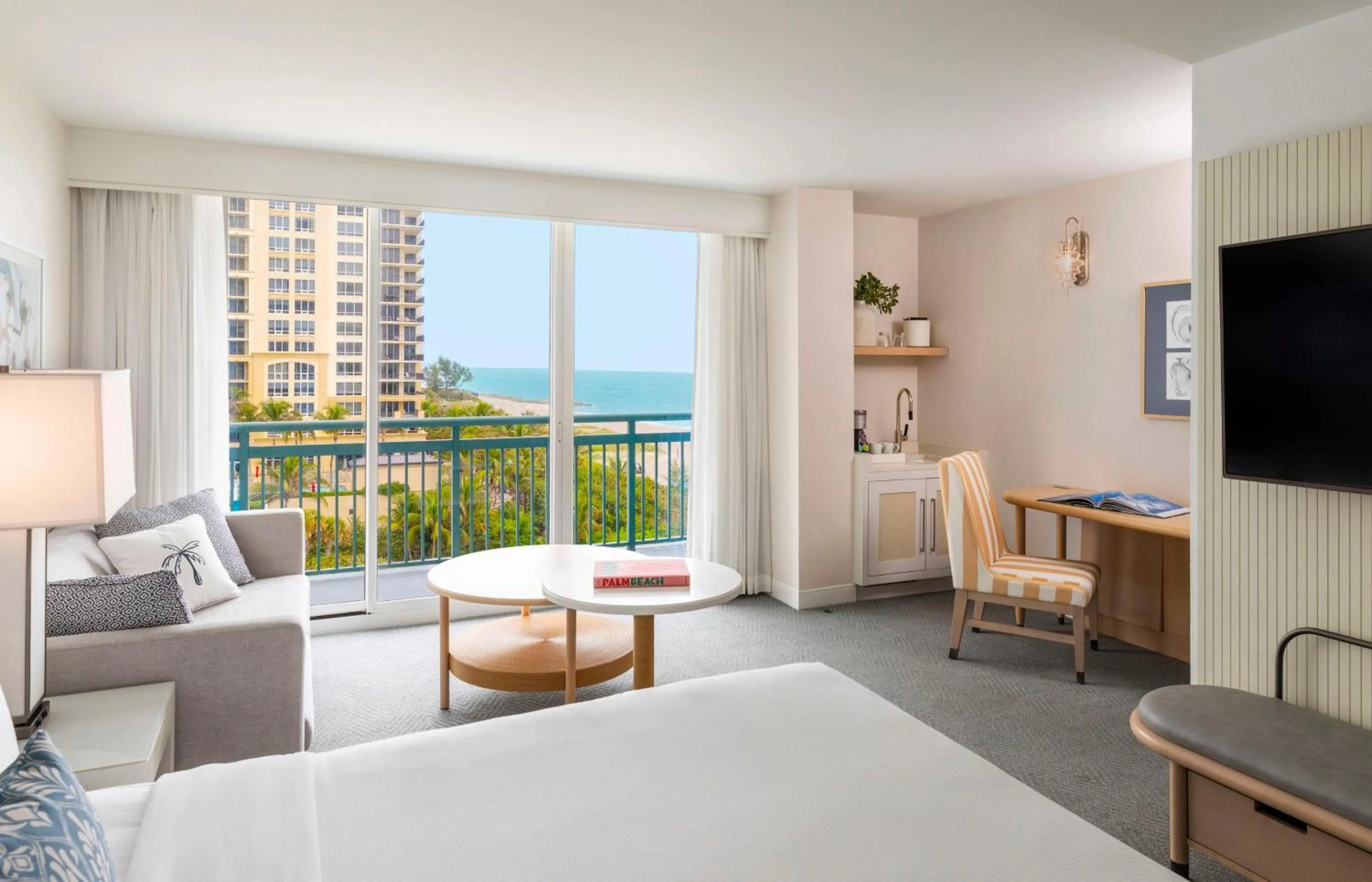 Living room, Bed in The Singer Oceanfront Resort, Curio Collection by Hilton