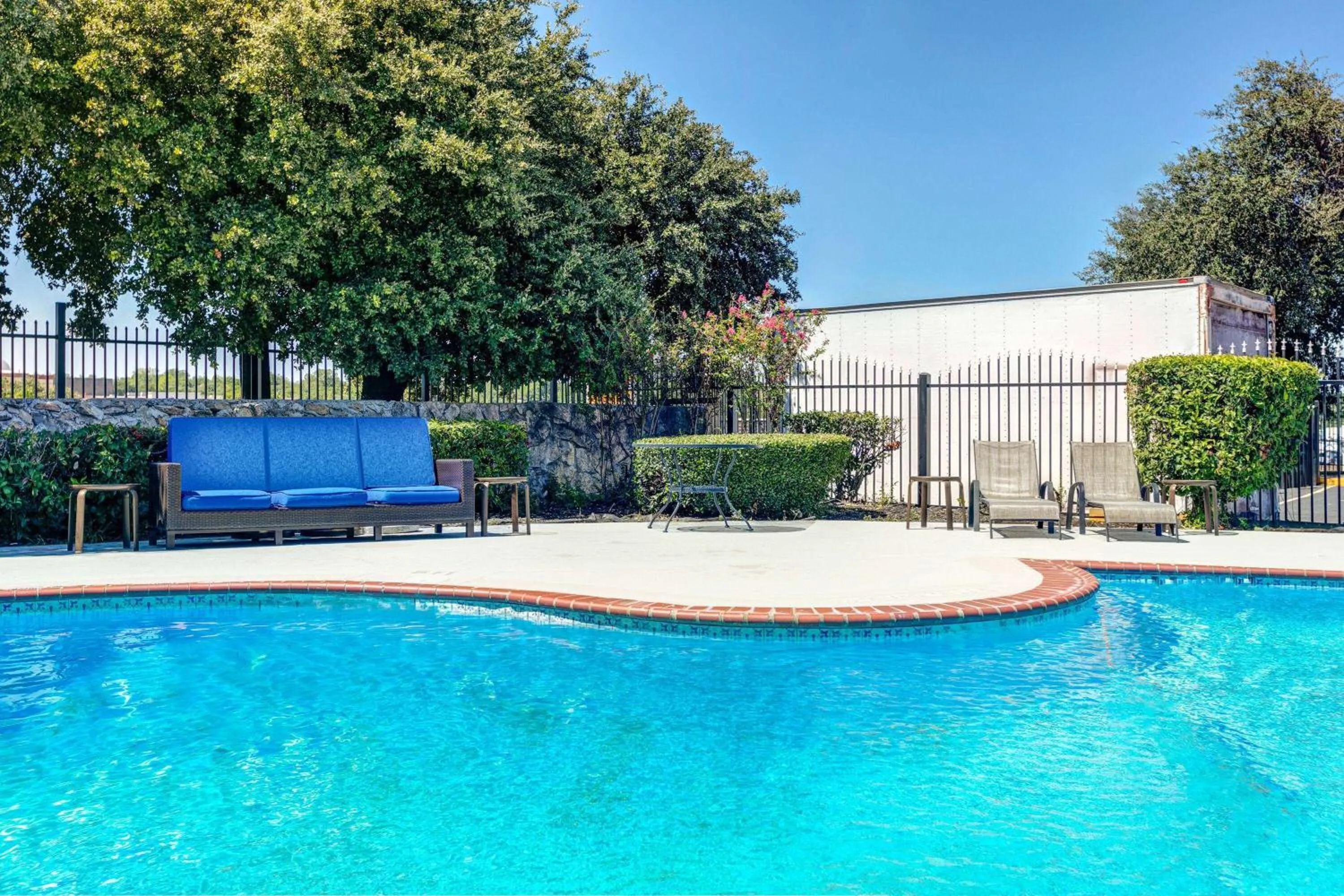 Swimming pool in Days Inn by Wyndham South Fort Worth