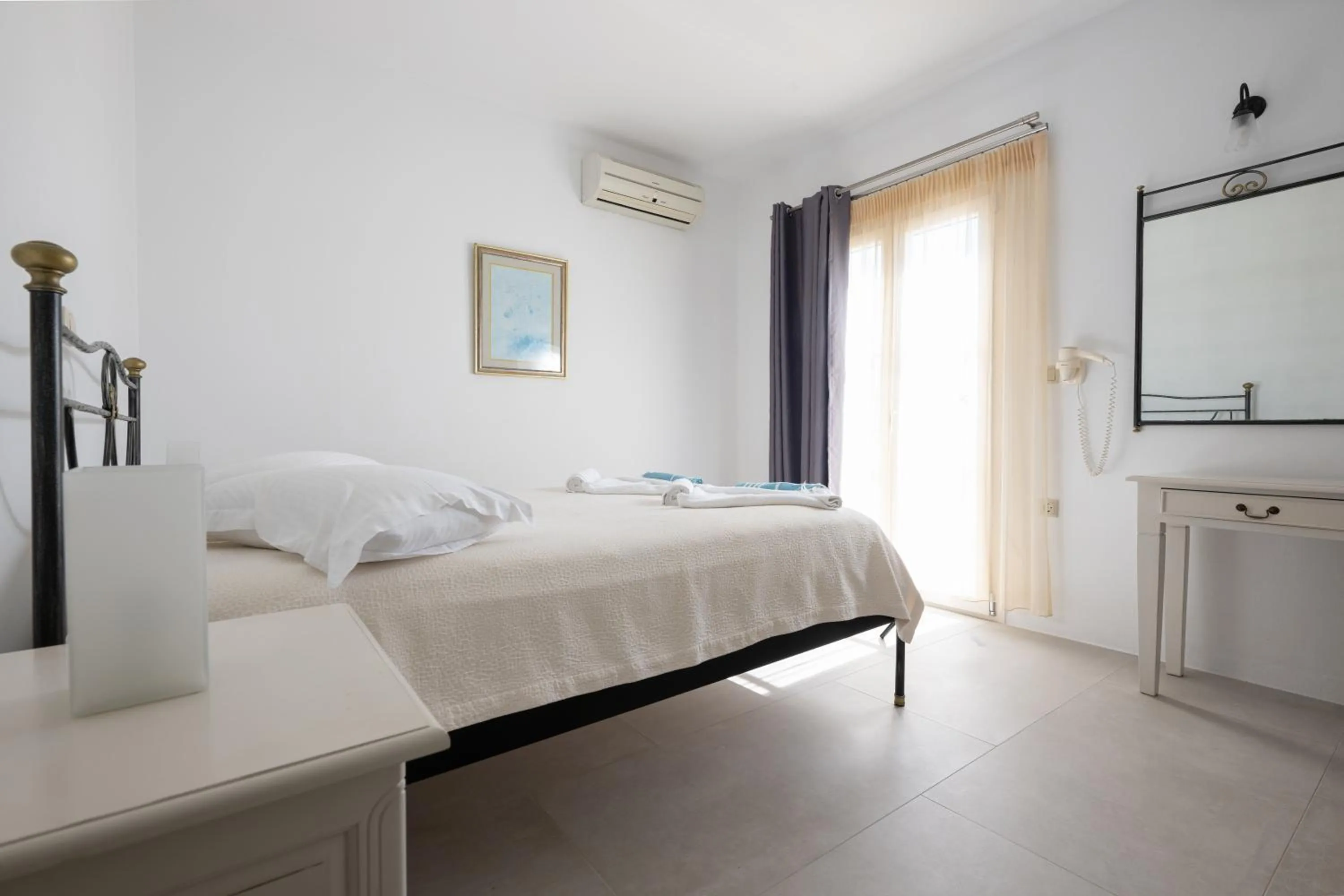 Bed in Iliada Villas
