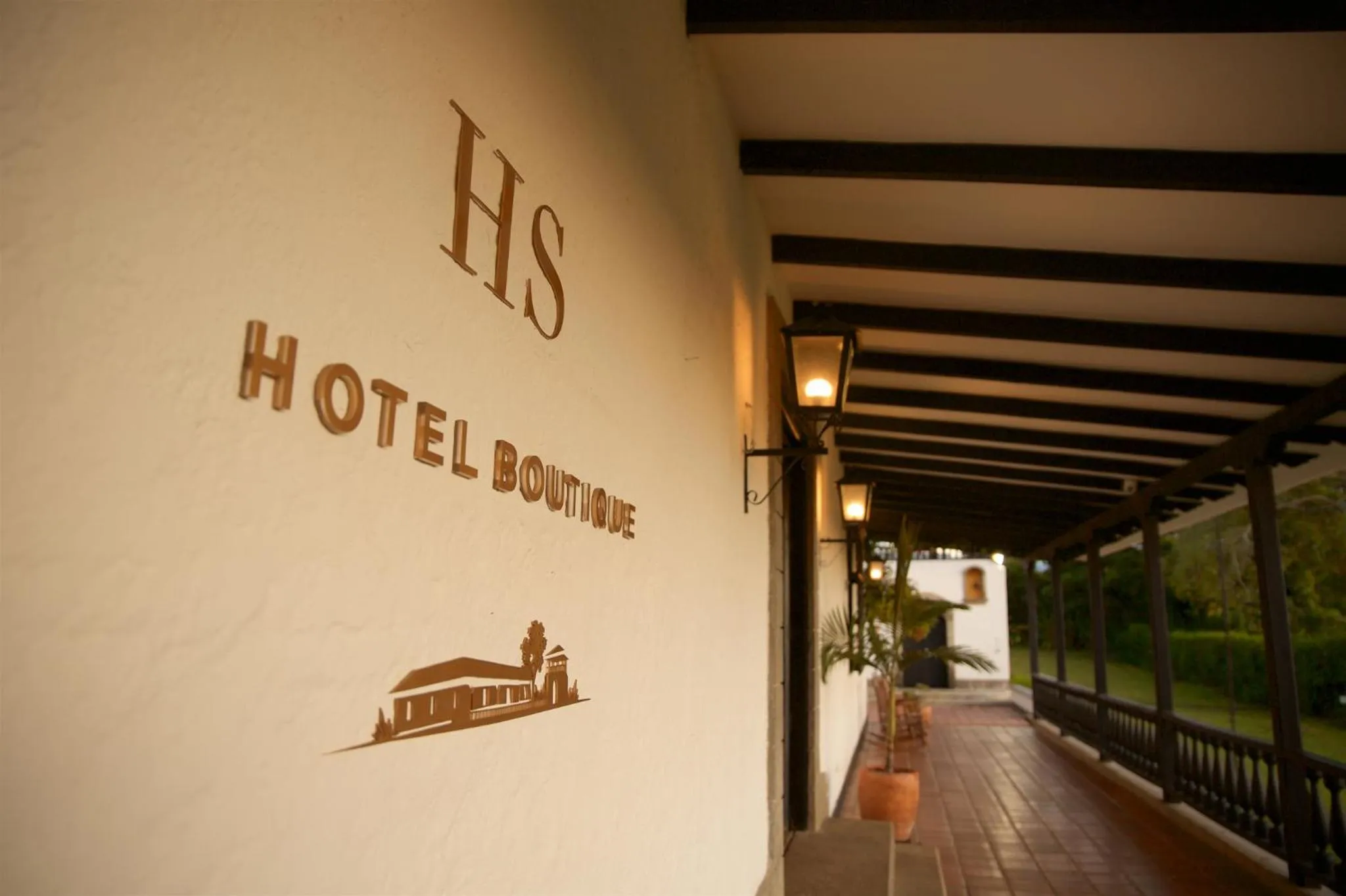 Property logo or sign in Hotel Hacienda Supracafe