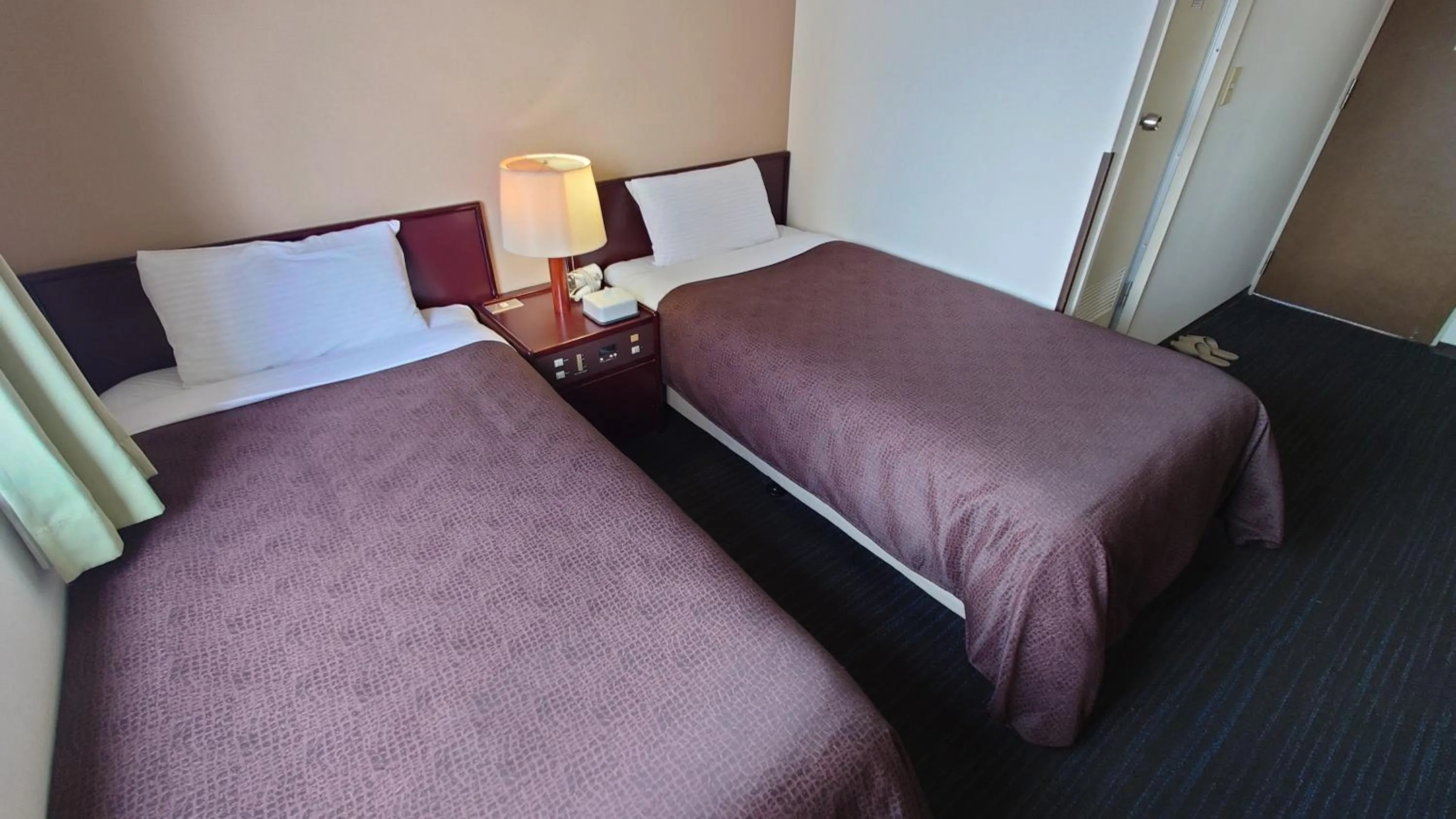 Bed in Select Inn Hamamatsu Ekimae