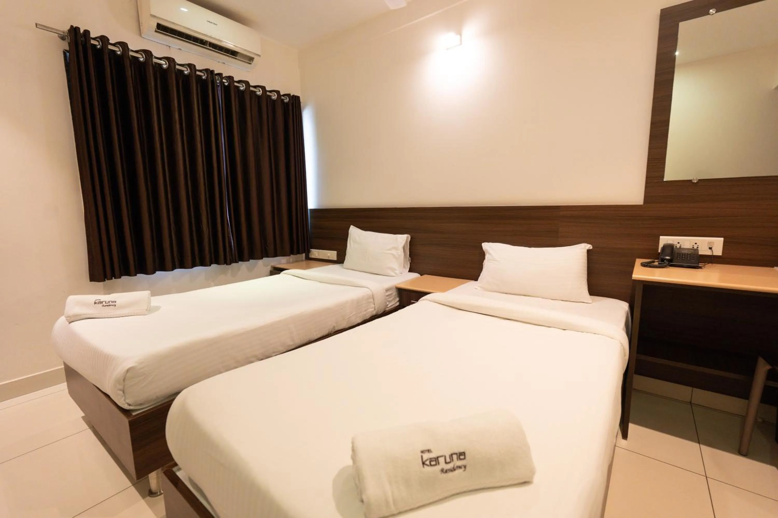 Bed in Hotel Karuna Residency