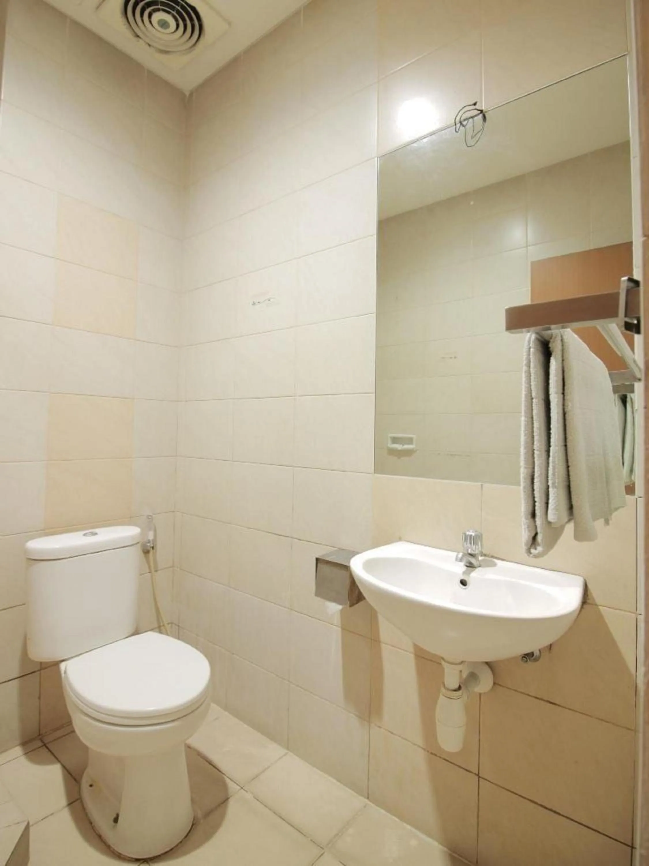 Bathroom in Capital O Galaxy Inn