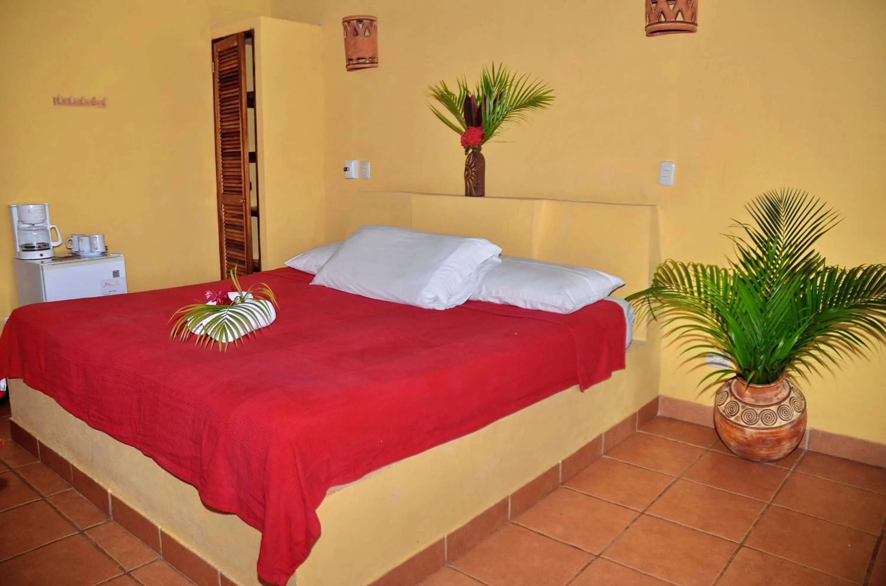Bed in Esencia Hotel and Villas