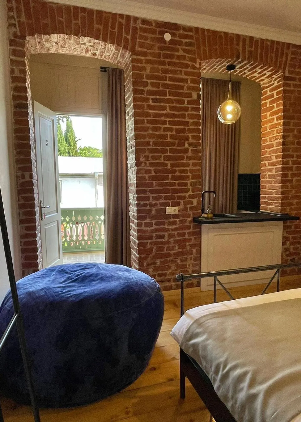 Seating area, Bed in Arts Hotel Tbilisi