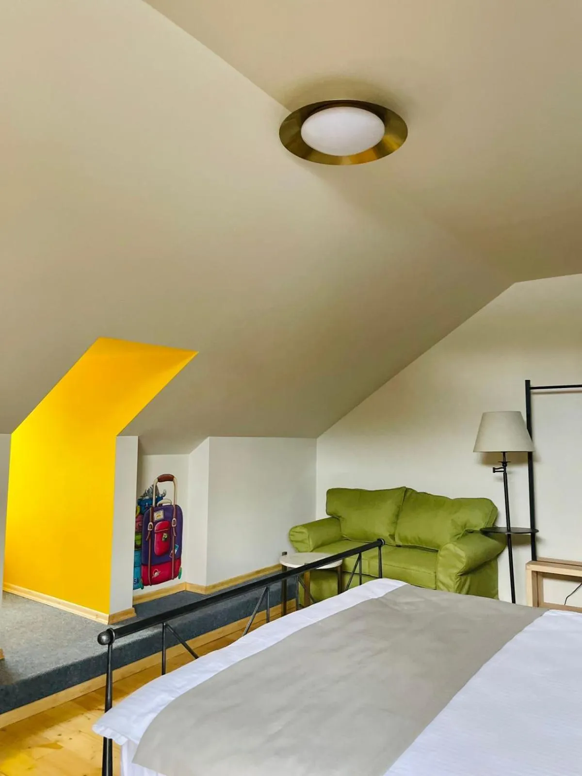 Seating area, Bed in Arts Hotel Tbilisi