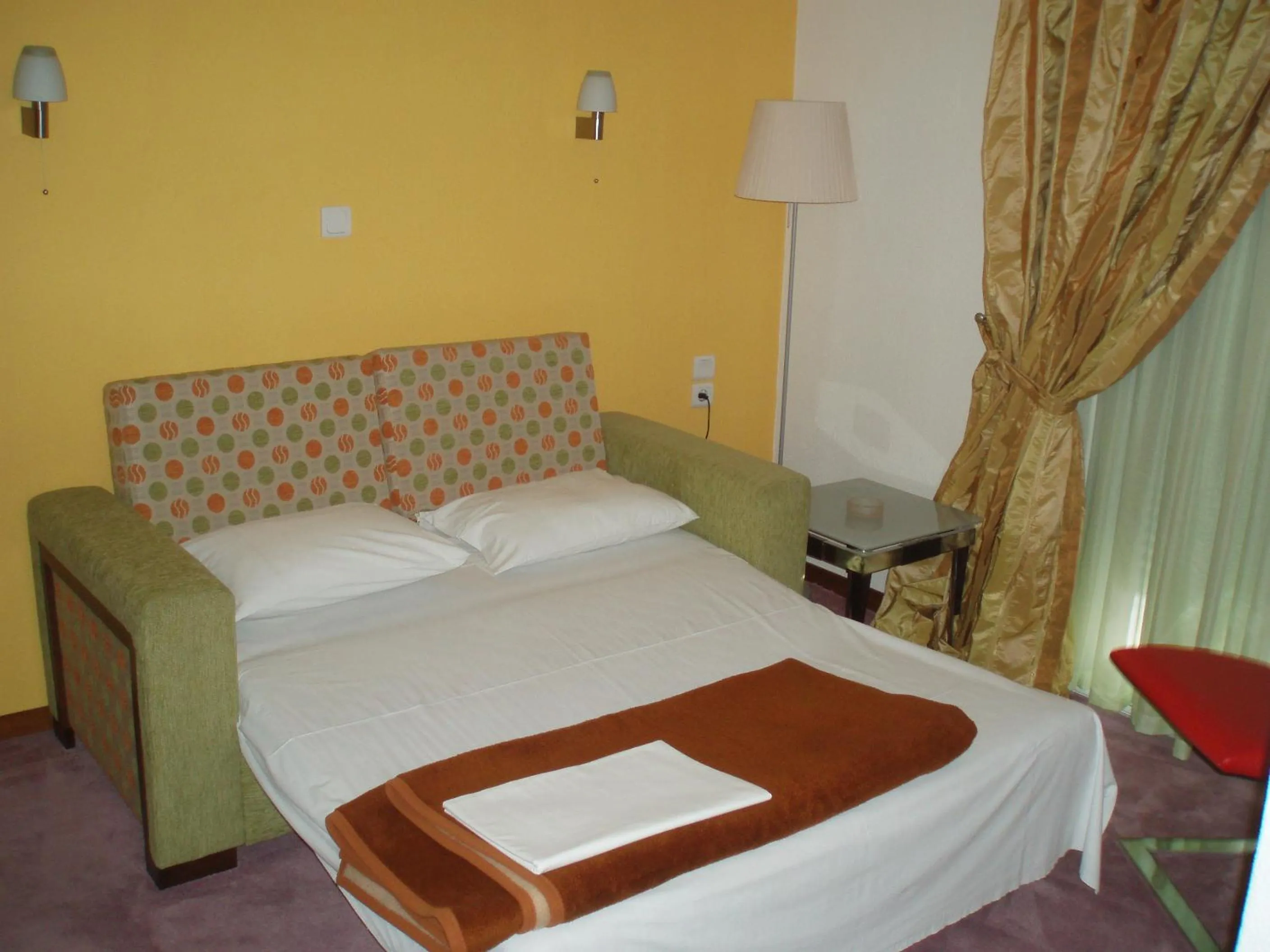 Bed in Hotel Orfeas