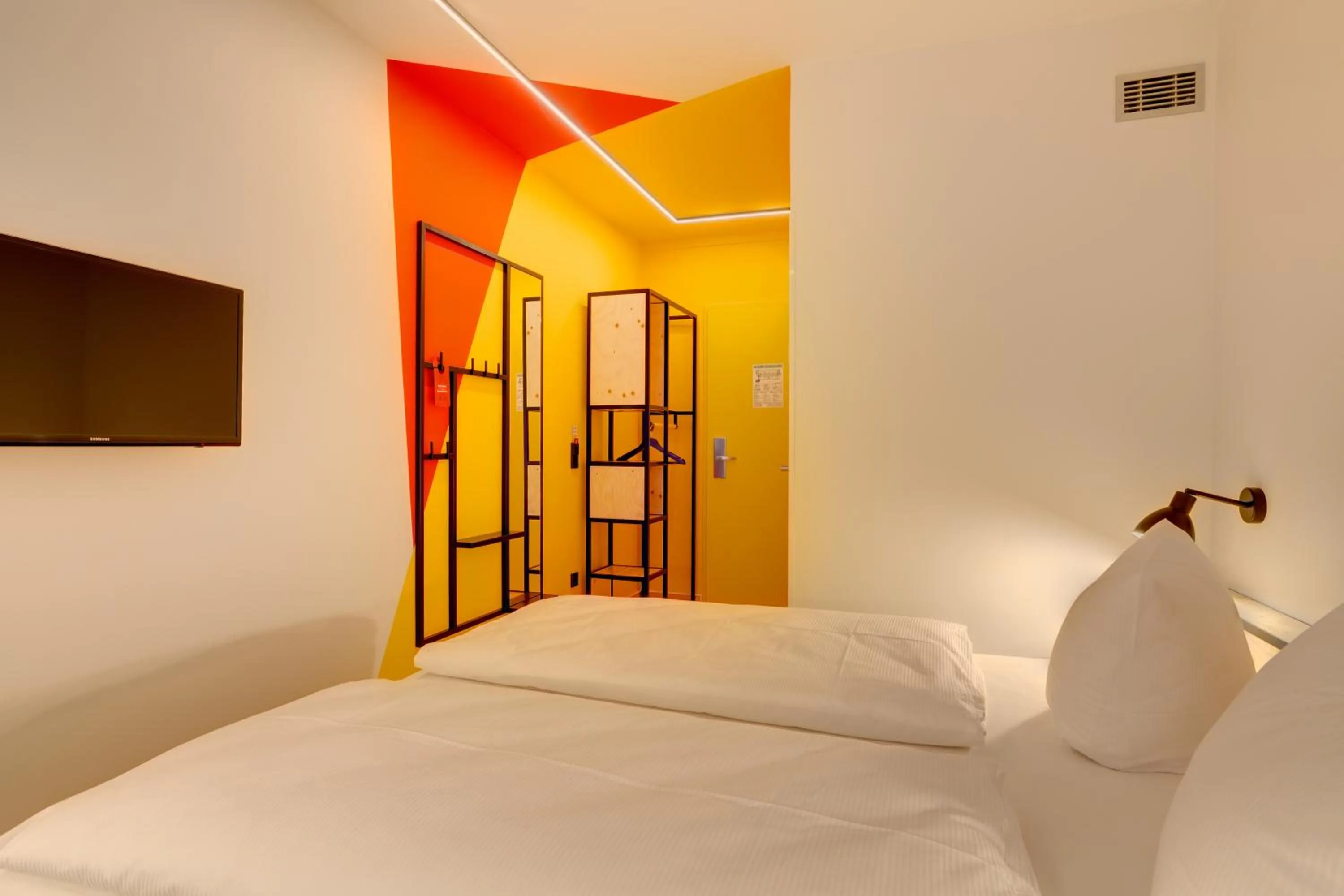 Photo of the whole room, Bed in MEININGER Hotel Leipzig Hauptbahnhof