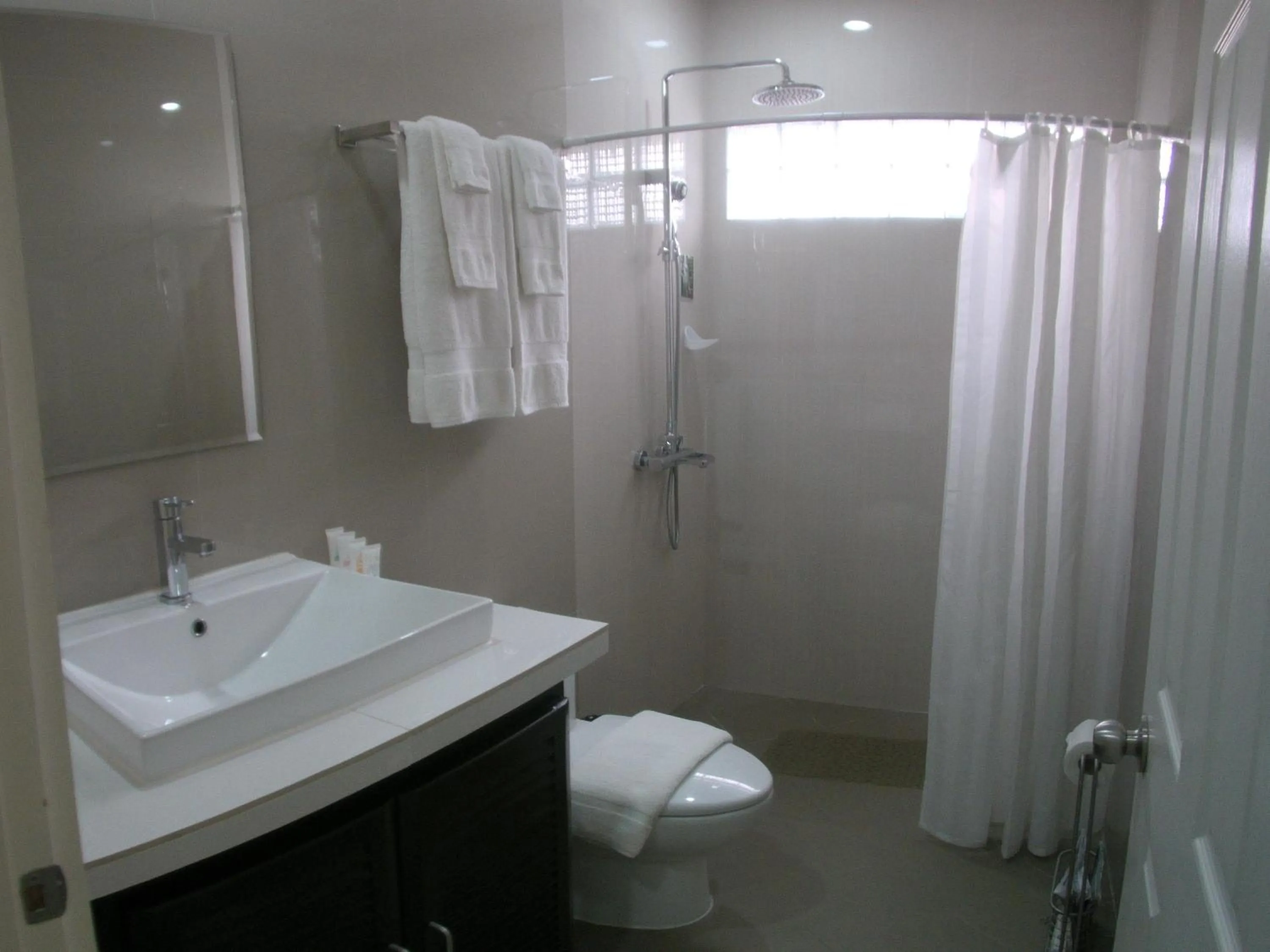 Shower in AJ's Place Beach Resort