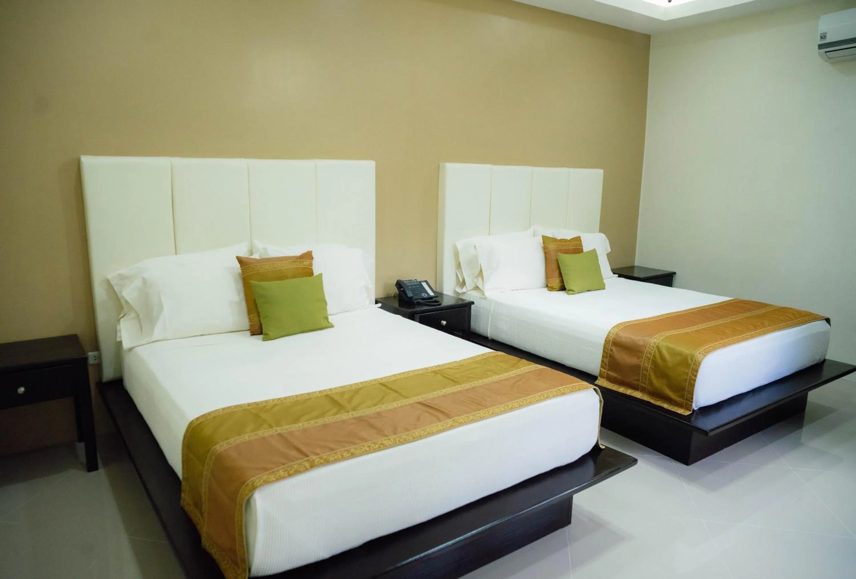 Bed in AJ's Place Beach Resort