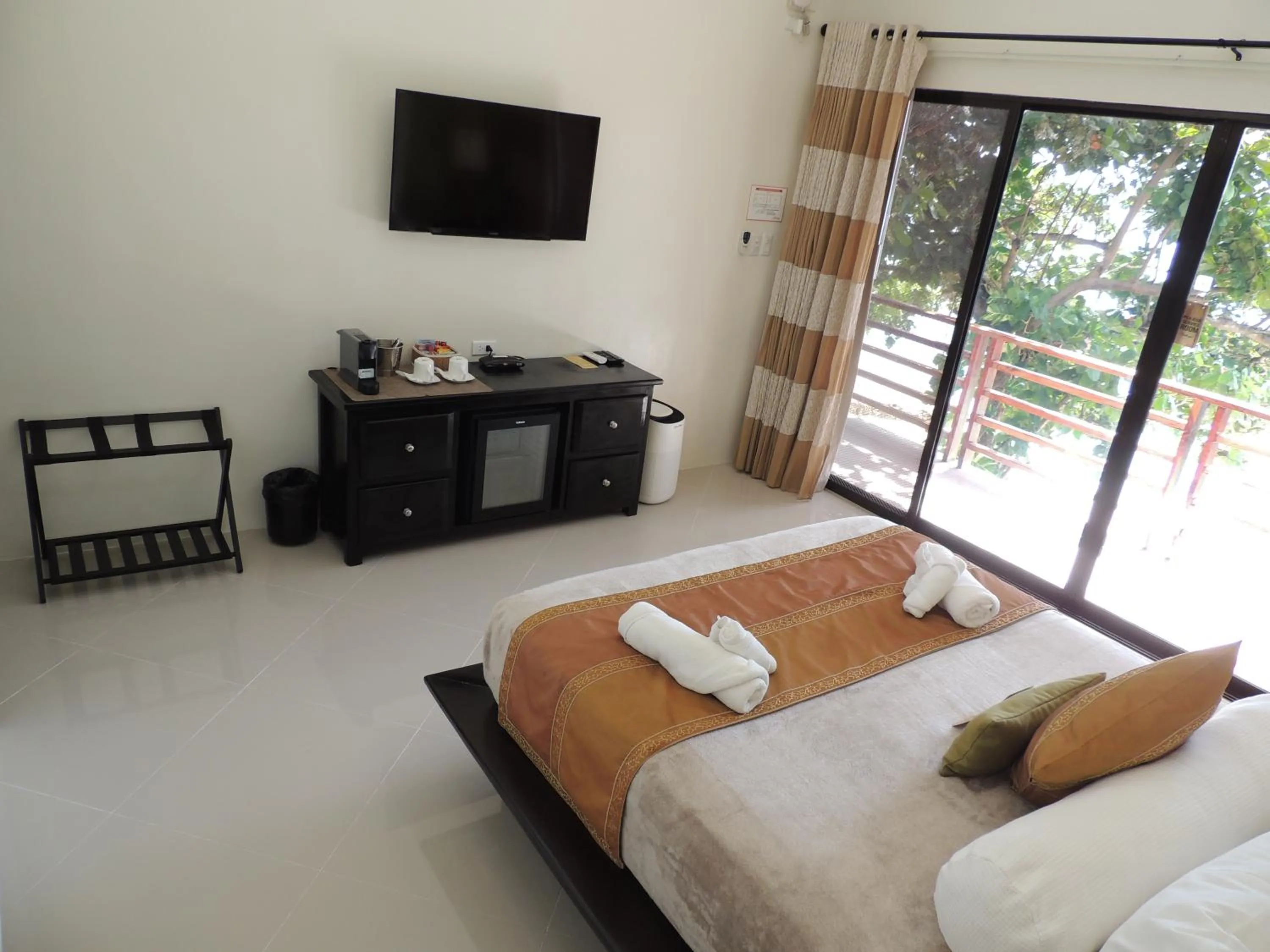 Coffee/tea facilities, Bed in AJ's Place Beach Resort