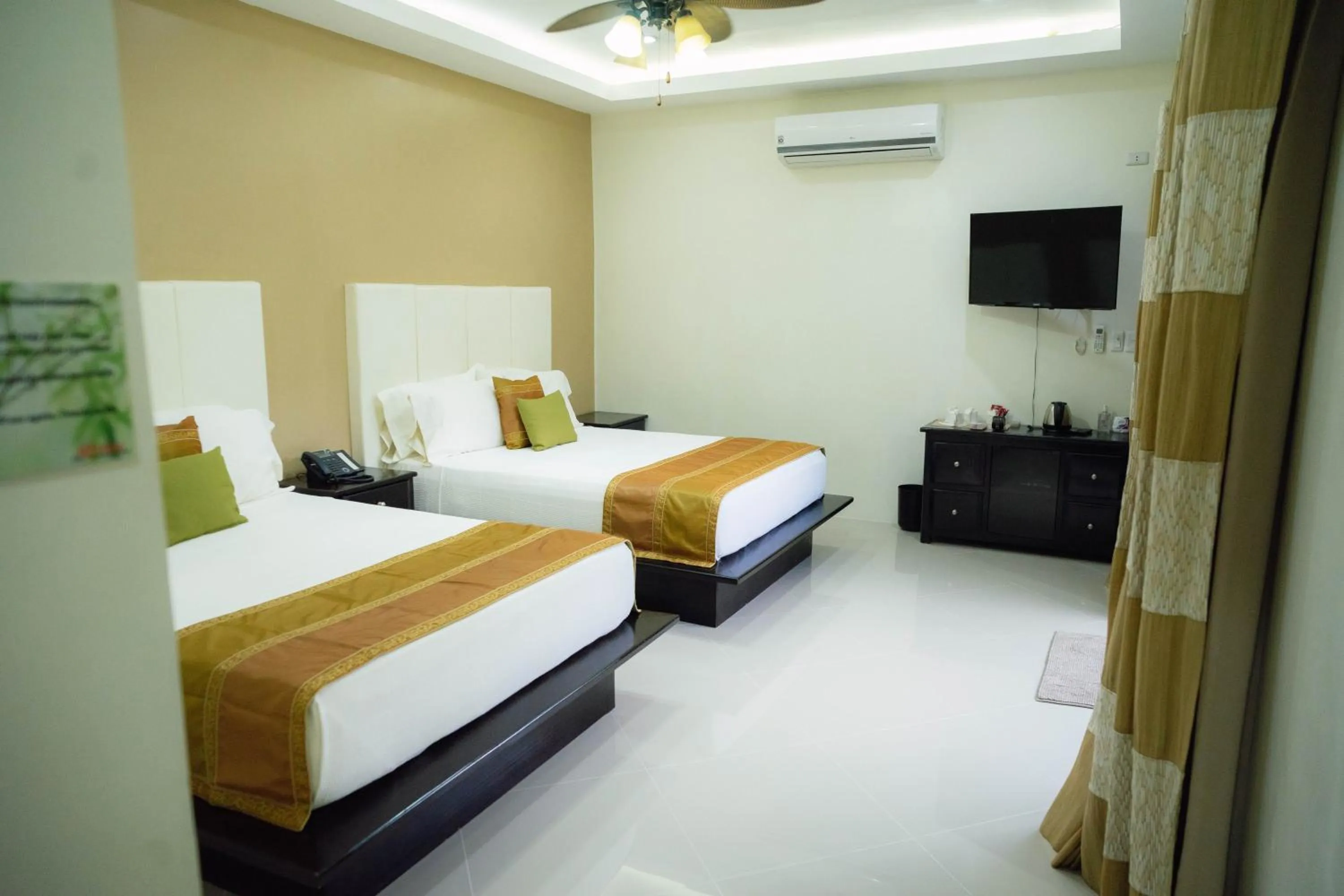 Bed in AJ's Place Beach Resort