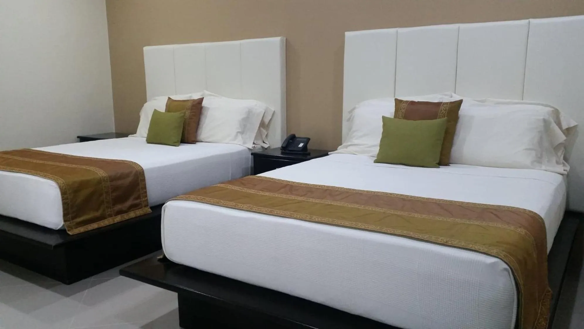 Bed in AJ's Place Beach Resort