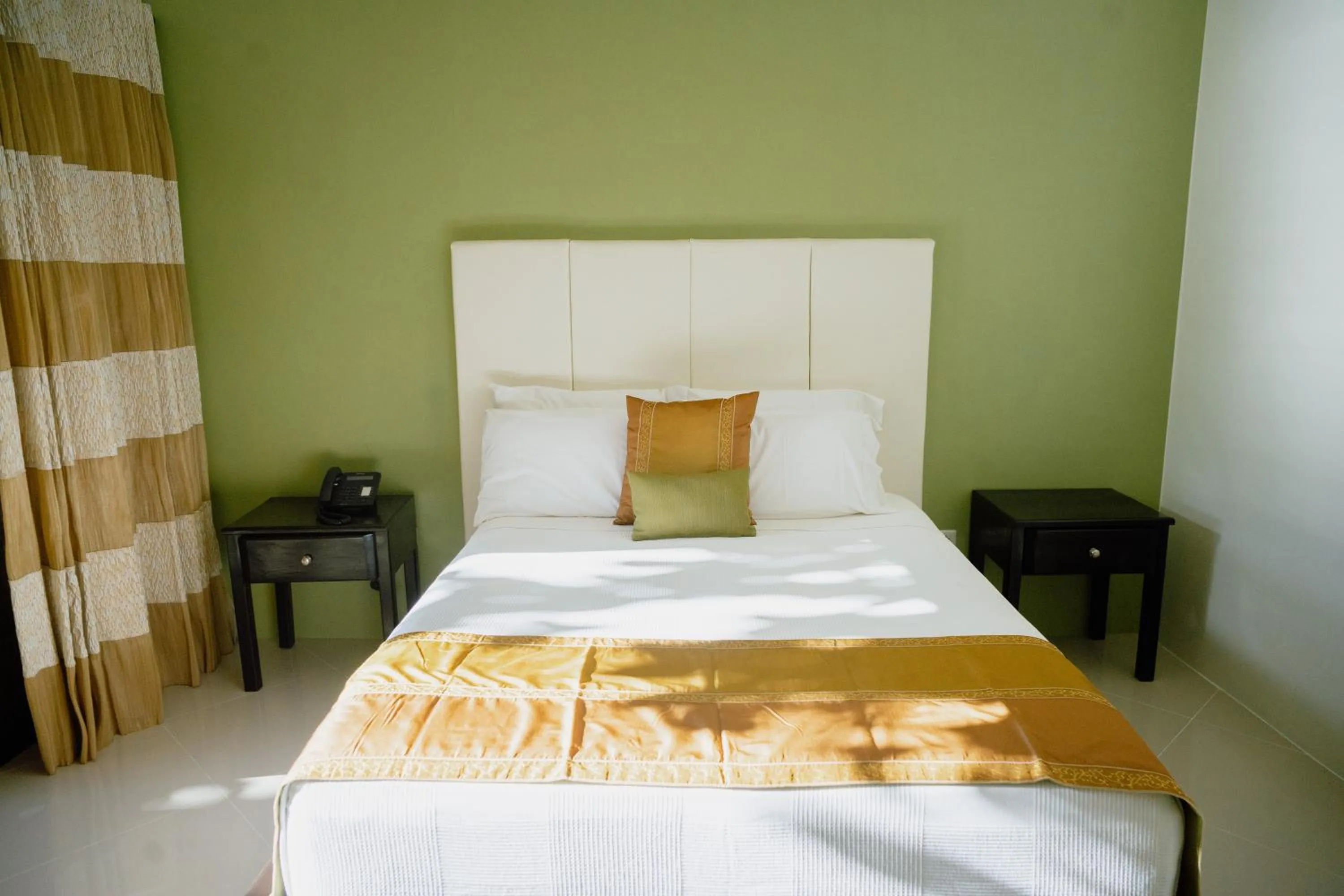 Bed in AJ's Place Beach Resort