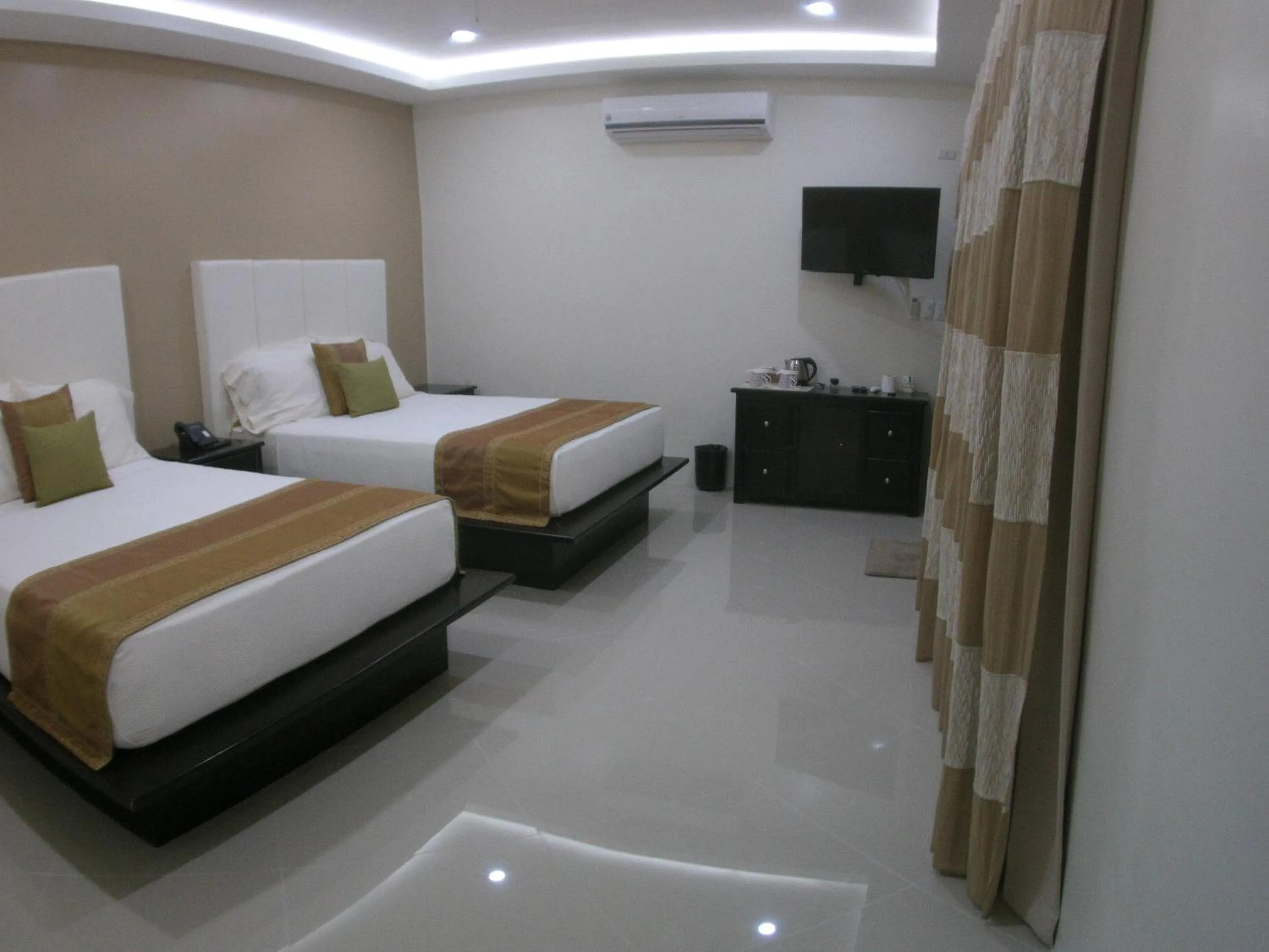 Bed in AJ's Place Beach Resort