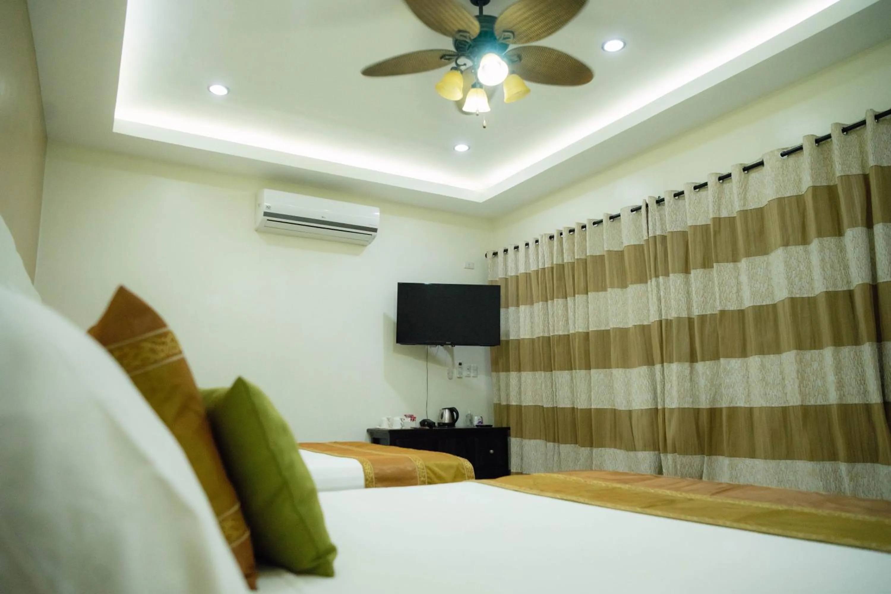 Bed in AJ's Place Beach Resort