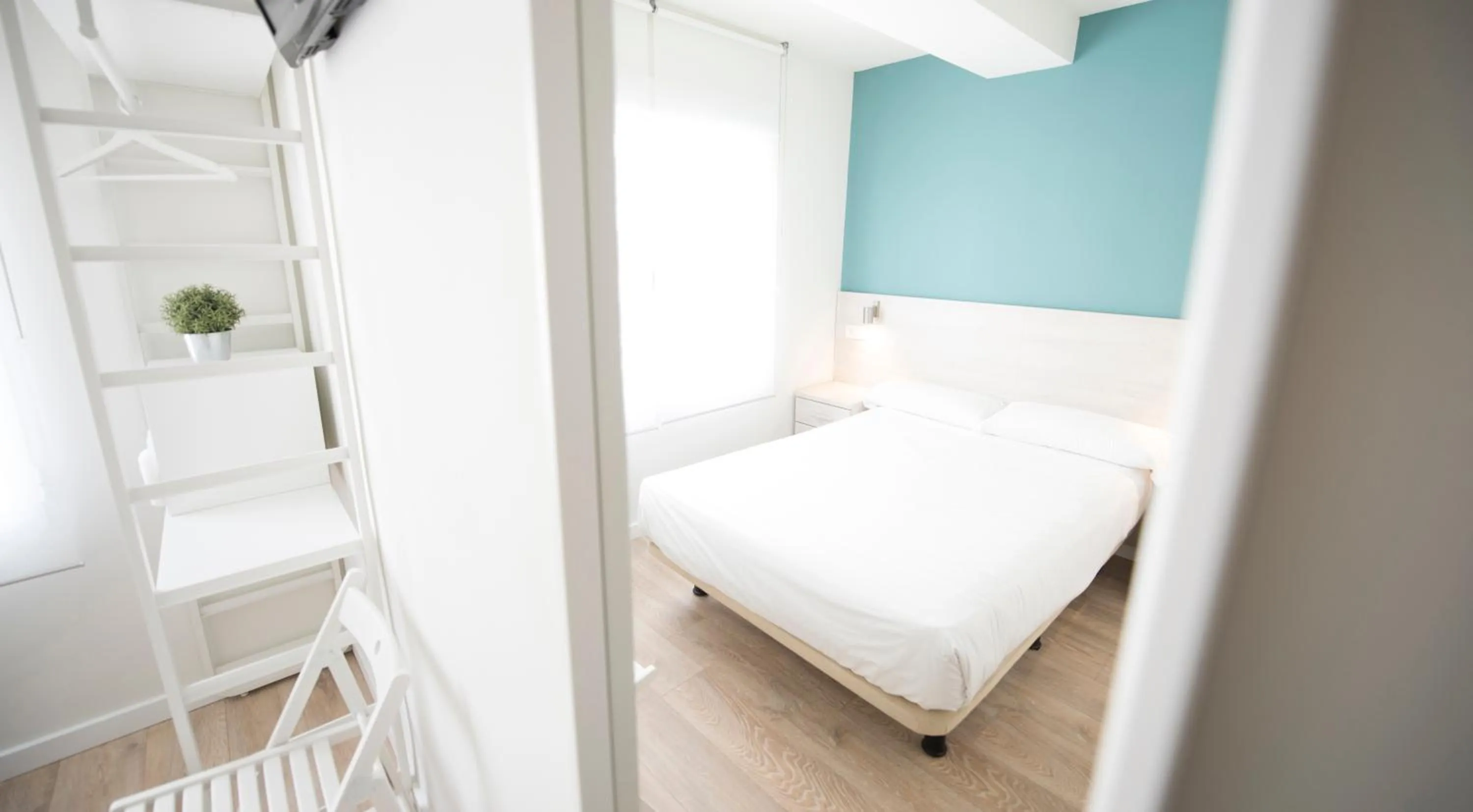 Decorative detail, Bed in Happy Hostal Carrales