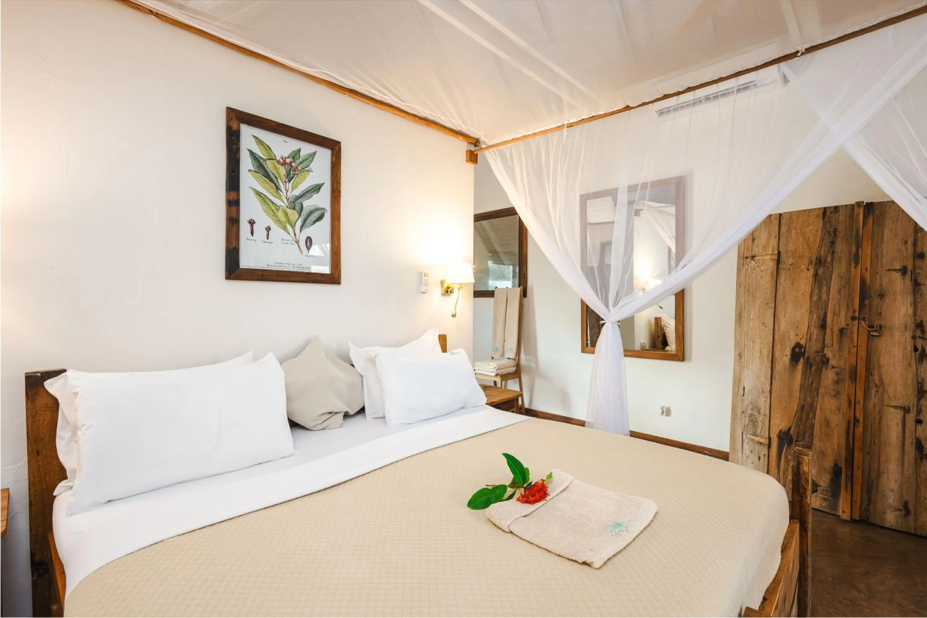 Bed in Clove Island Villas & Spa